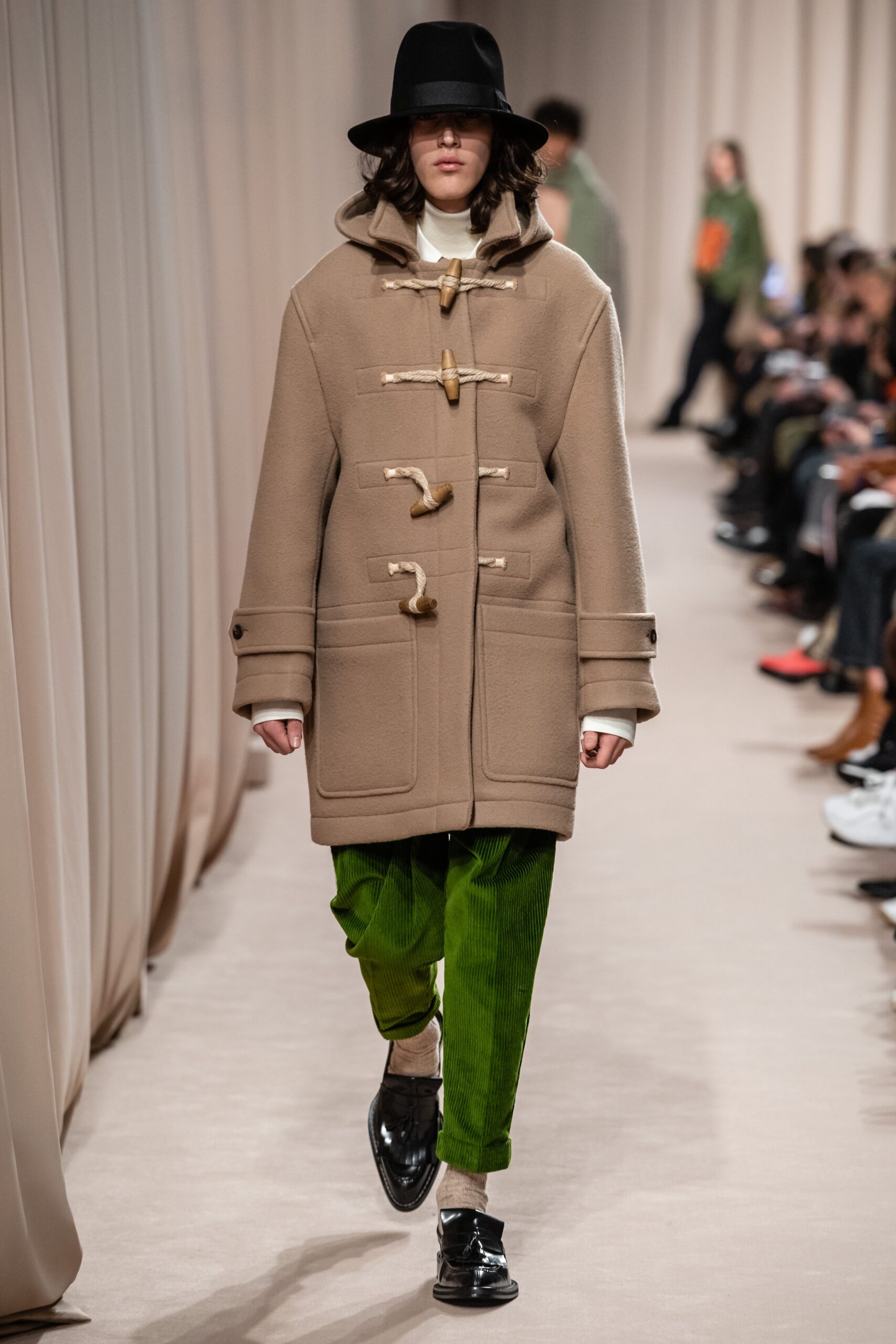 beige wool relaxed coat and green pants