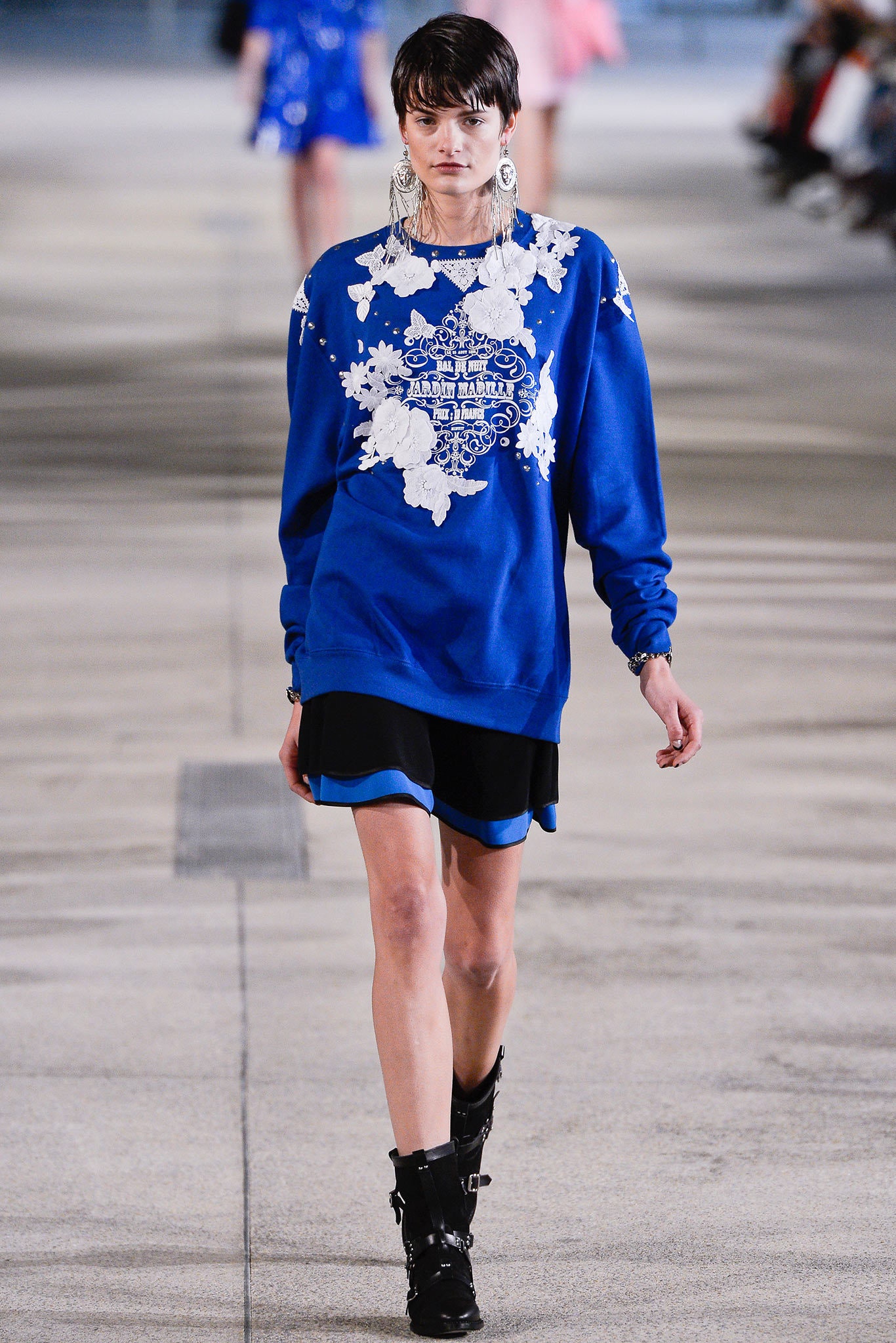 blue embroidered sweater with black skirt