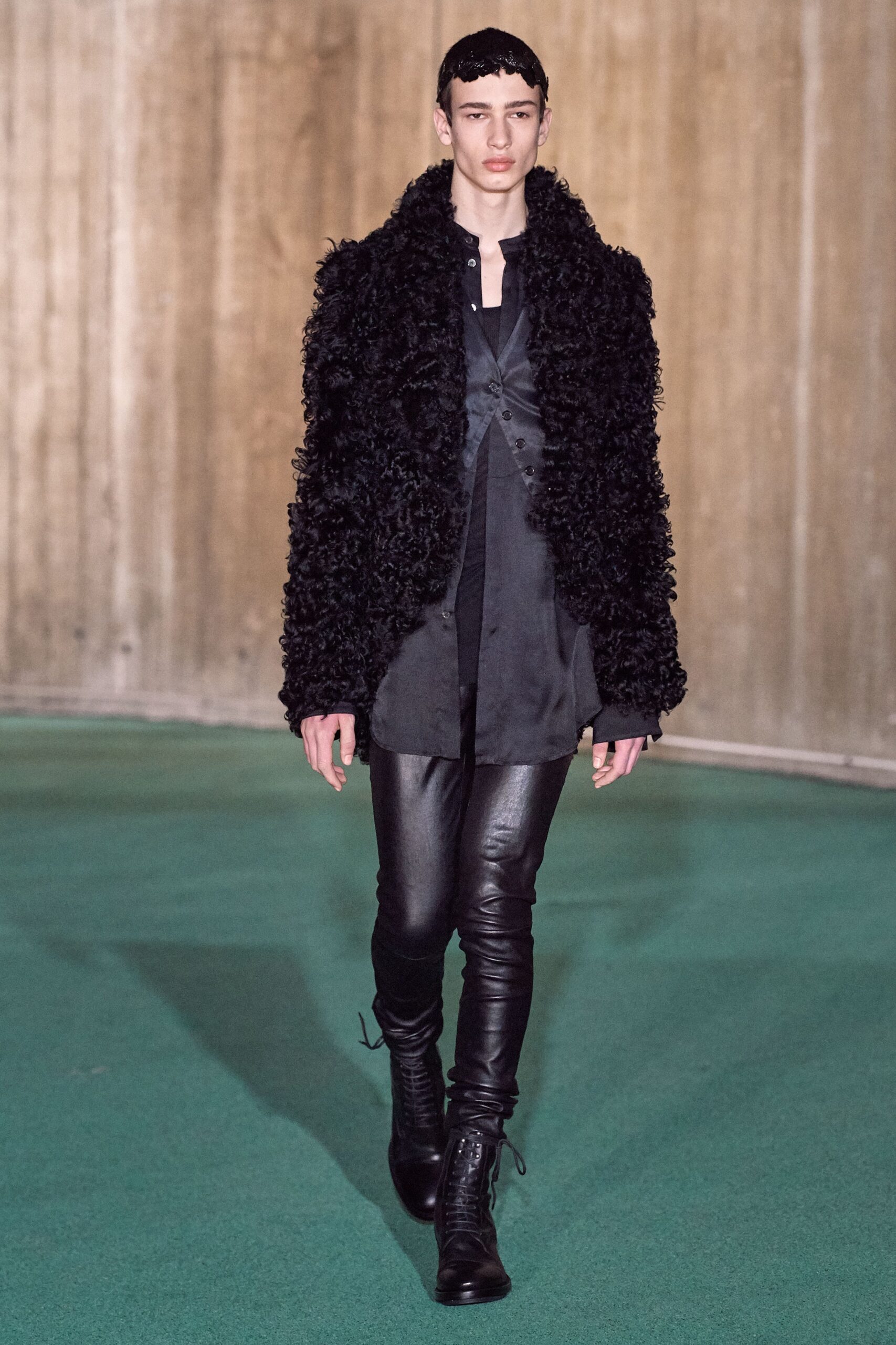 black faux-fur coat with leather pants