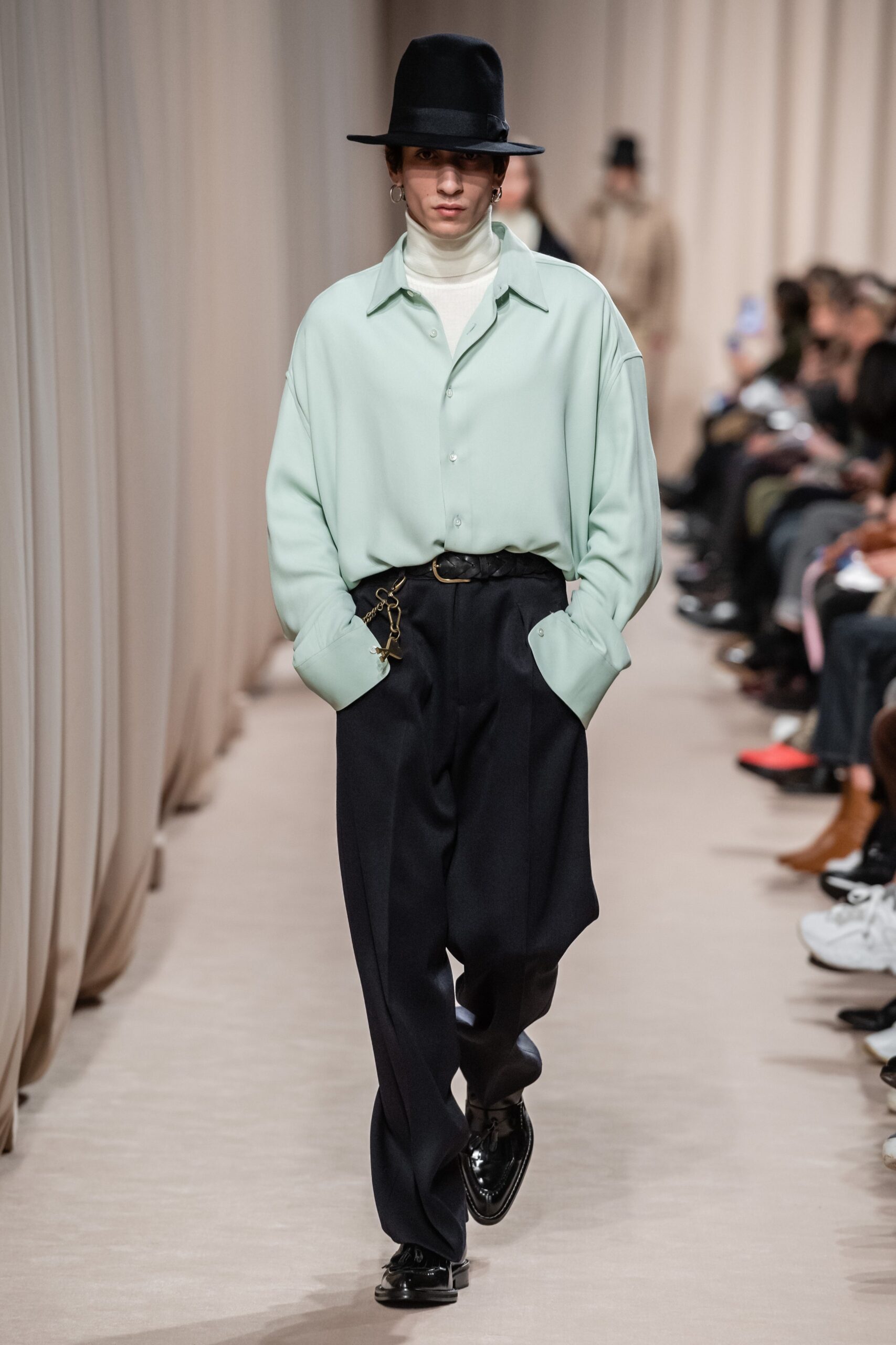 oversized green shirt with relaxed black pants