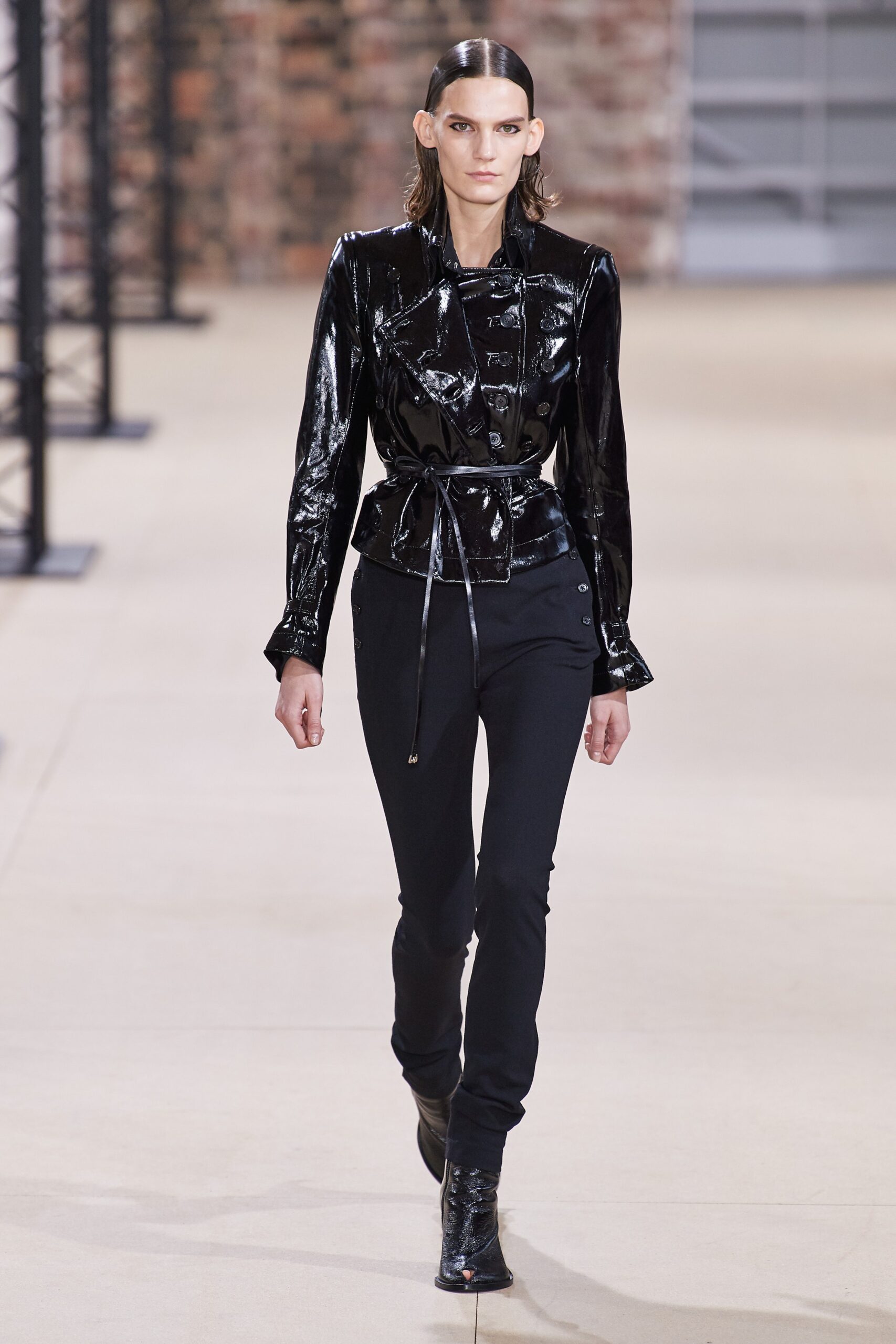 black vinyl fitted jacket and slim pants