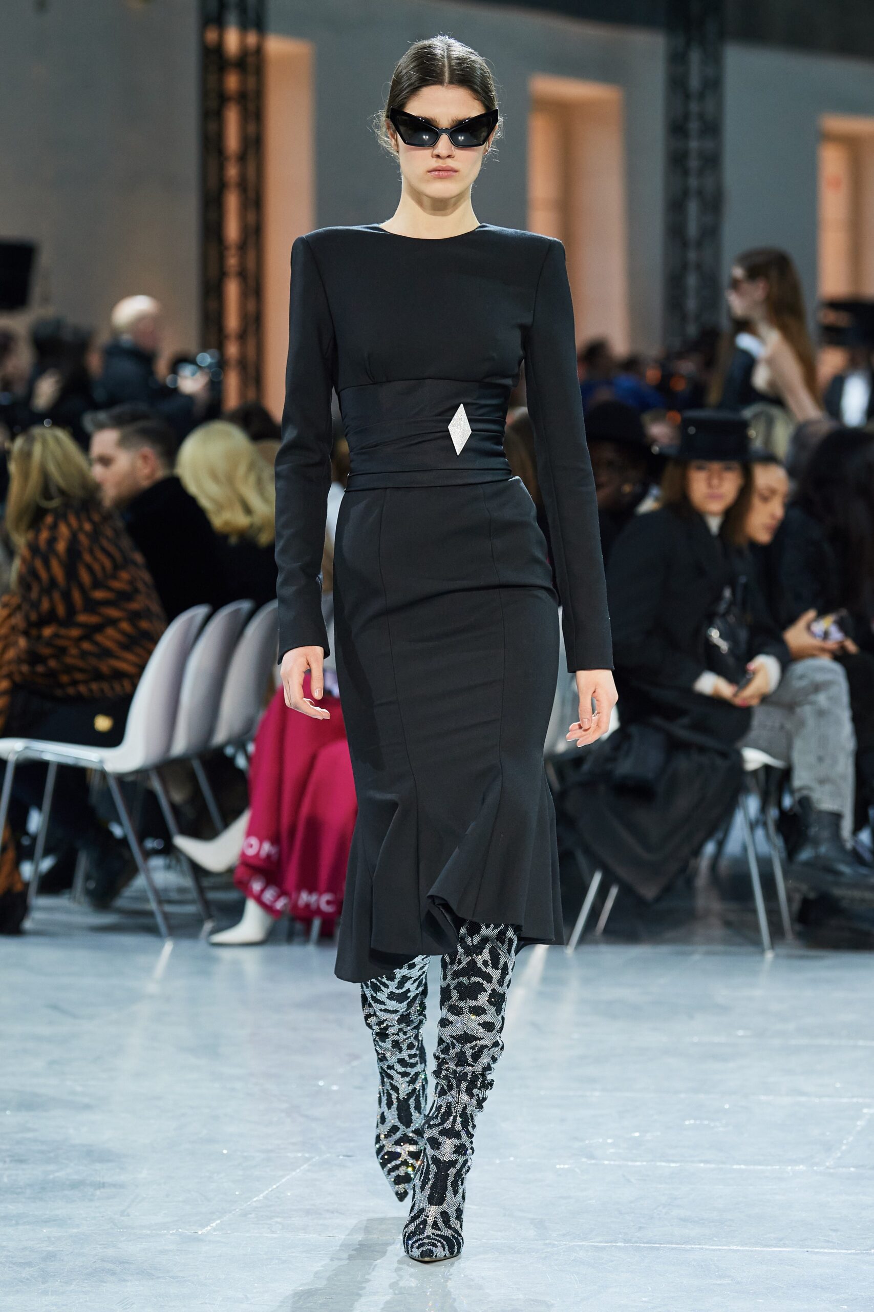 black fitted midi dress with animal-print boots