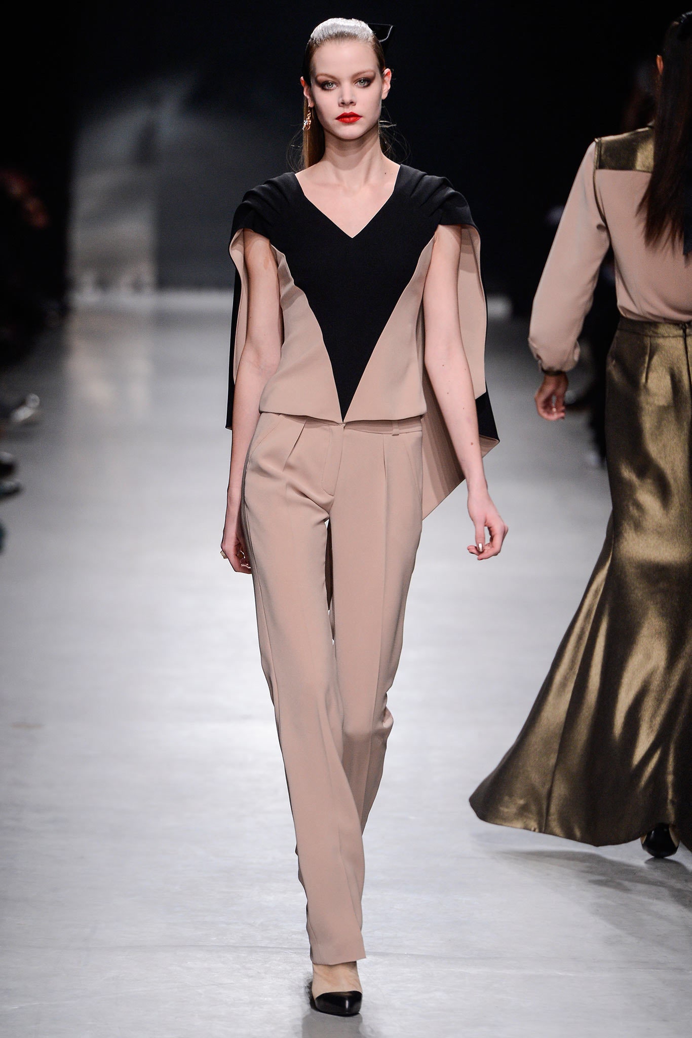 beige and black color-blocked top with fitted pants