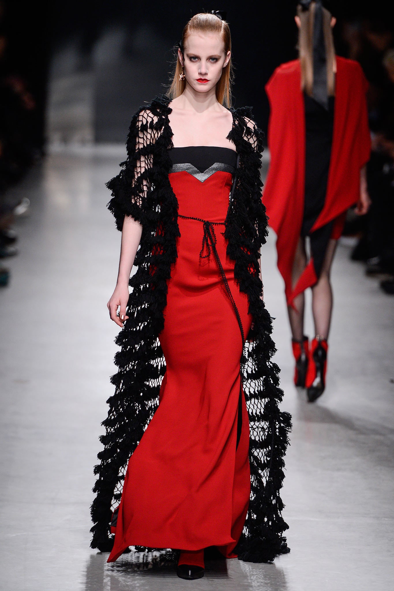red silk fitted gown with black lace cape