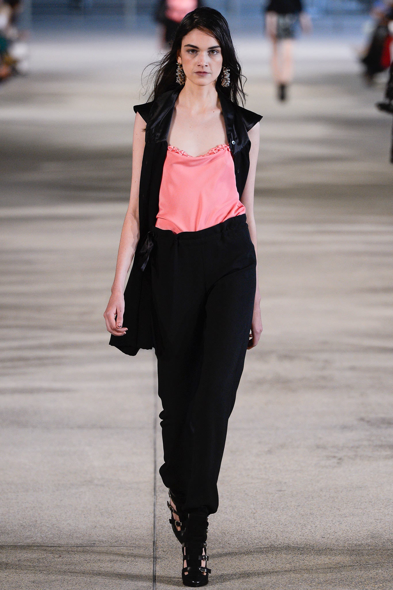 pink sleeveless top with black vest