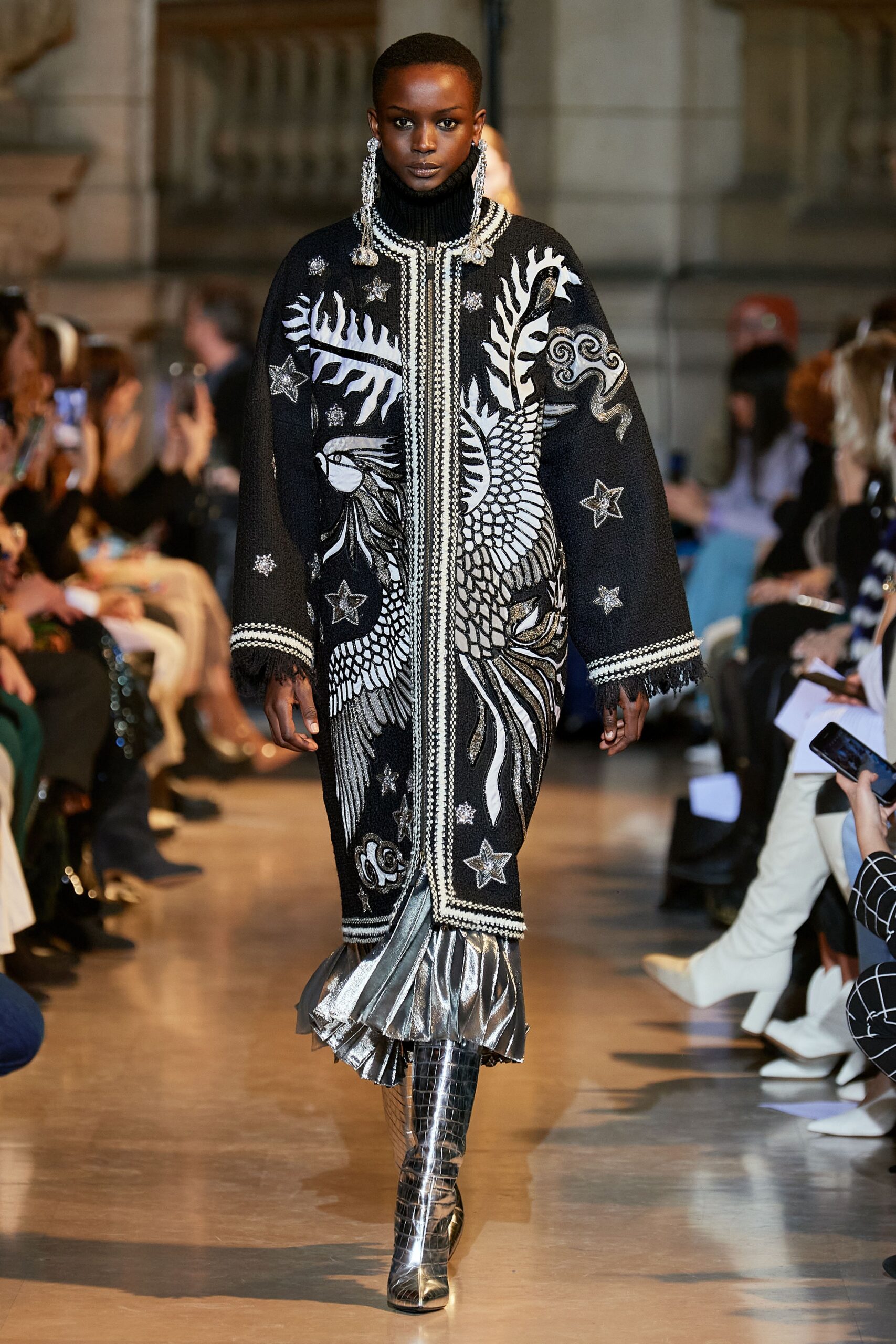 black and white embroidered coat with silver boots