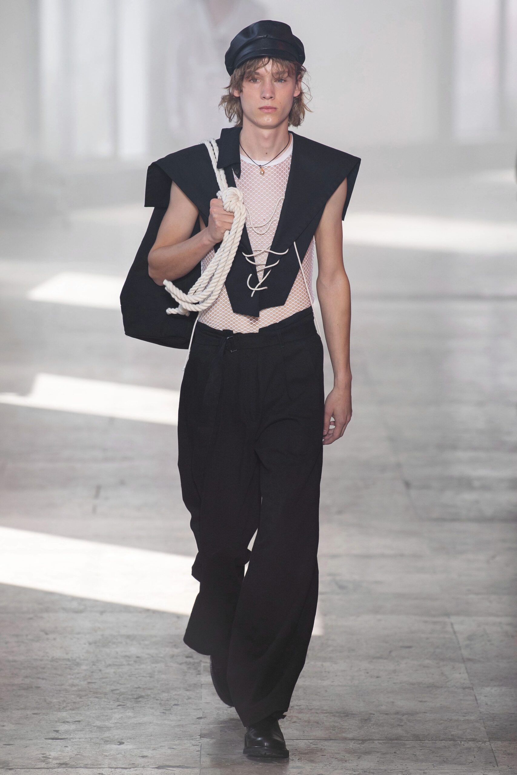 black fitted sleeveless top with relaxed pants
