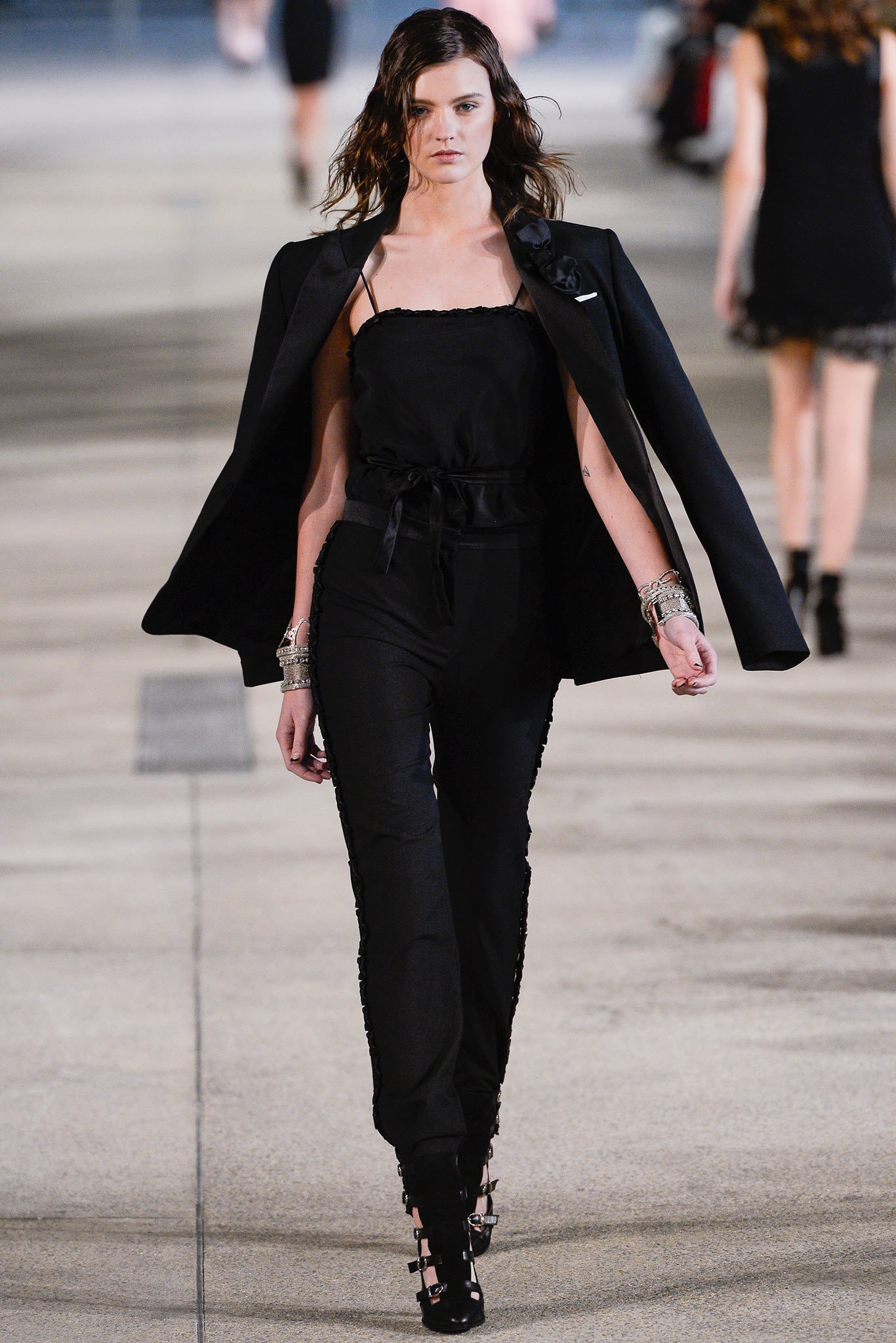 black structured jacket and fitted jumpsuit