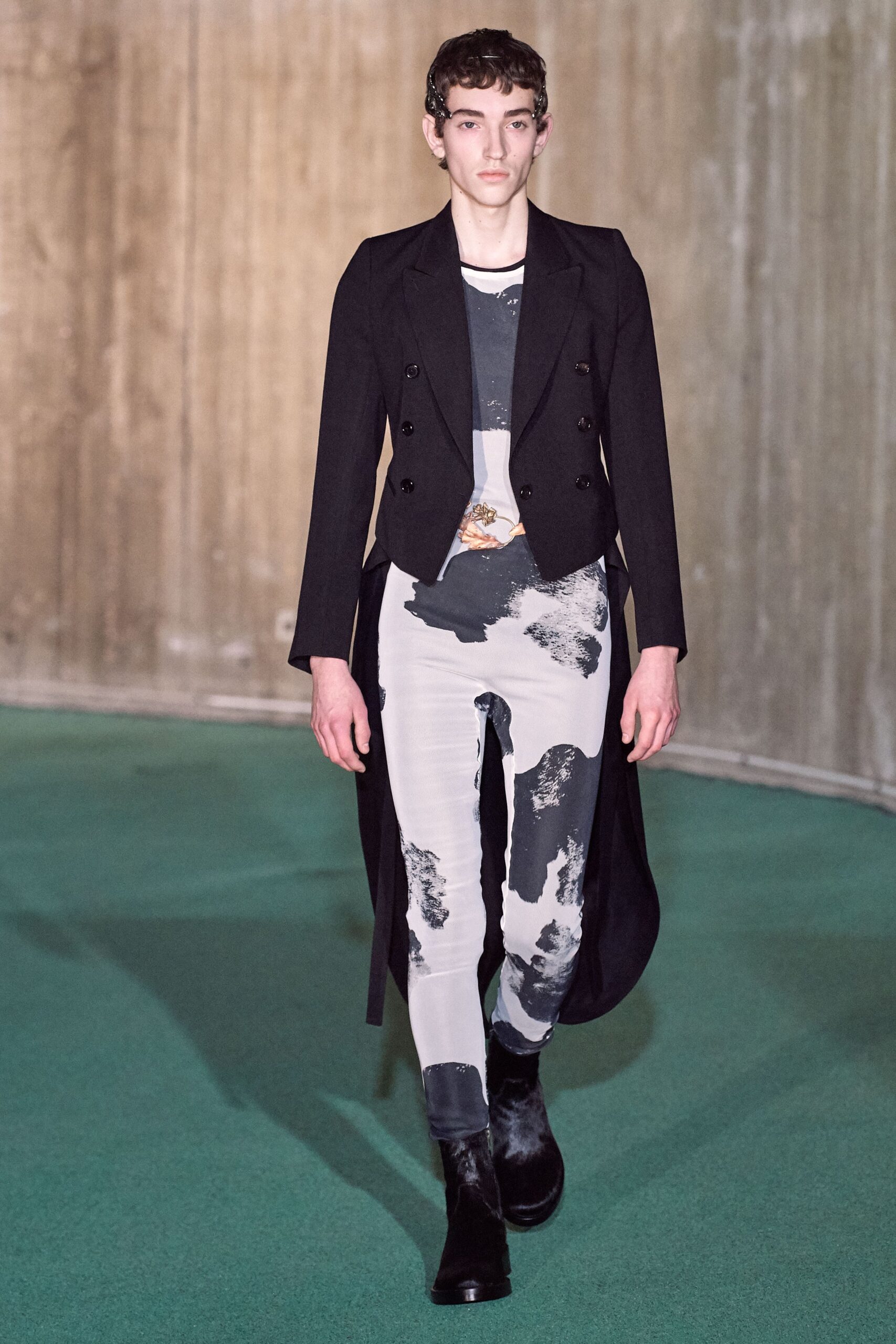 black tailored jacket with gray catsuit