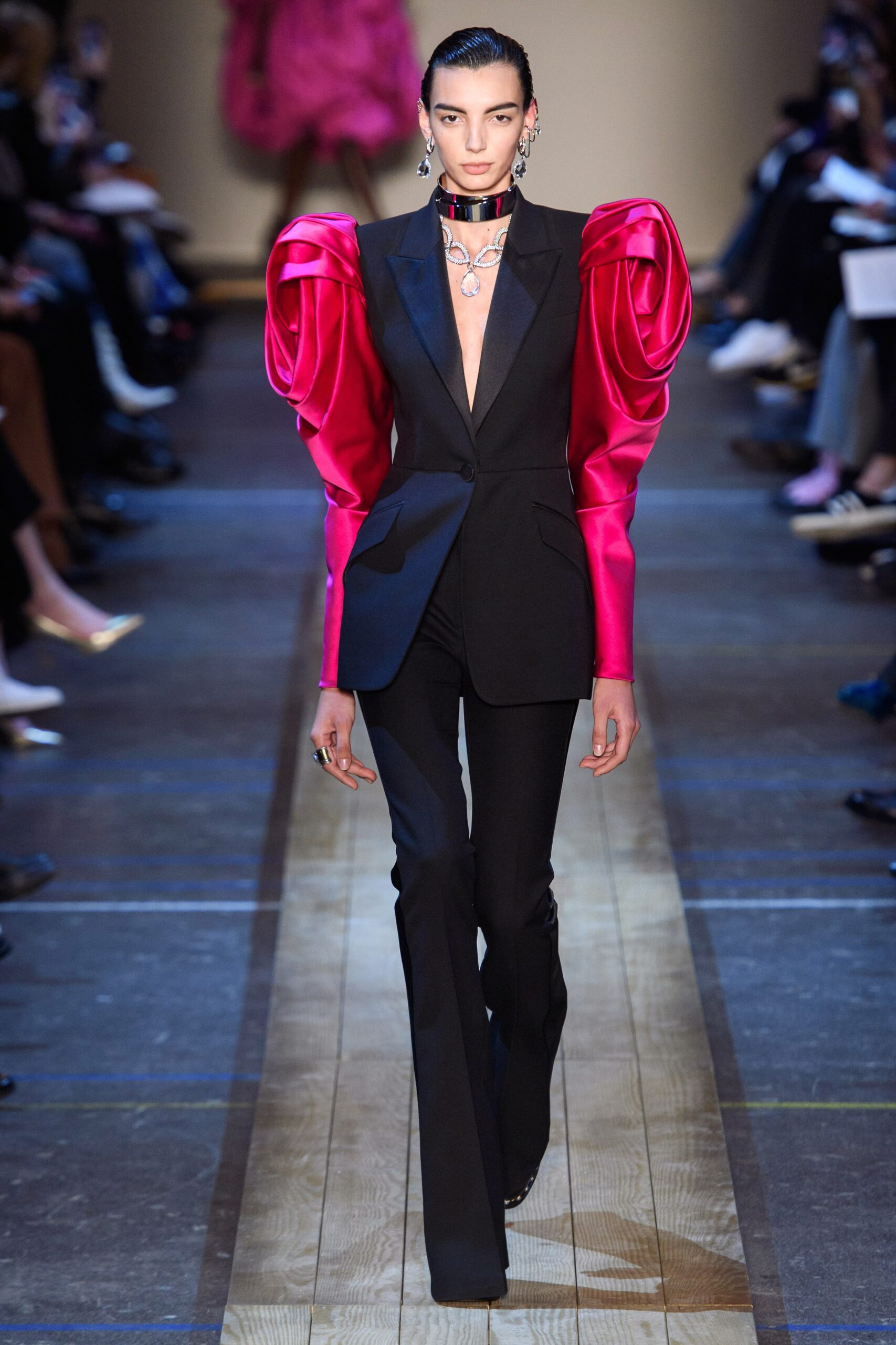 black fitted blazer with pink ruffled top