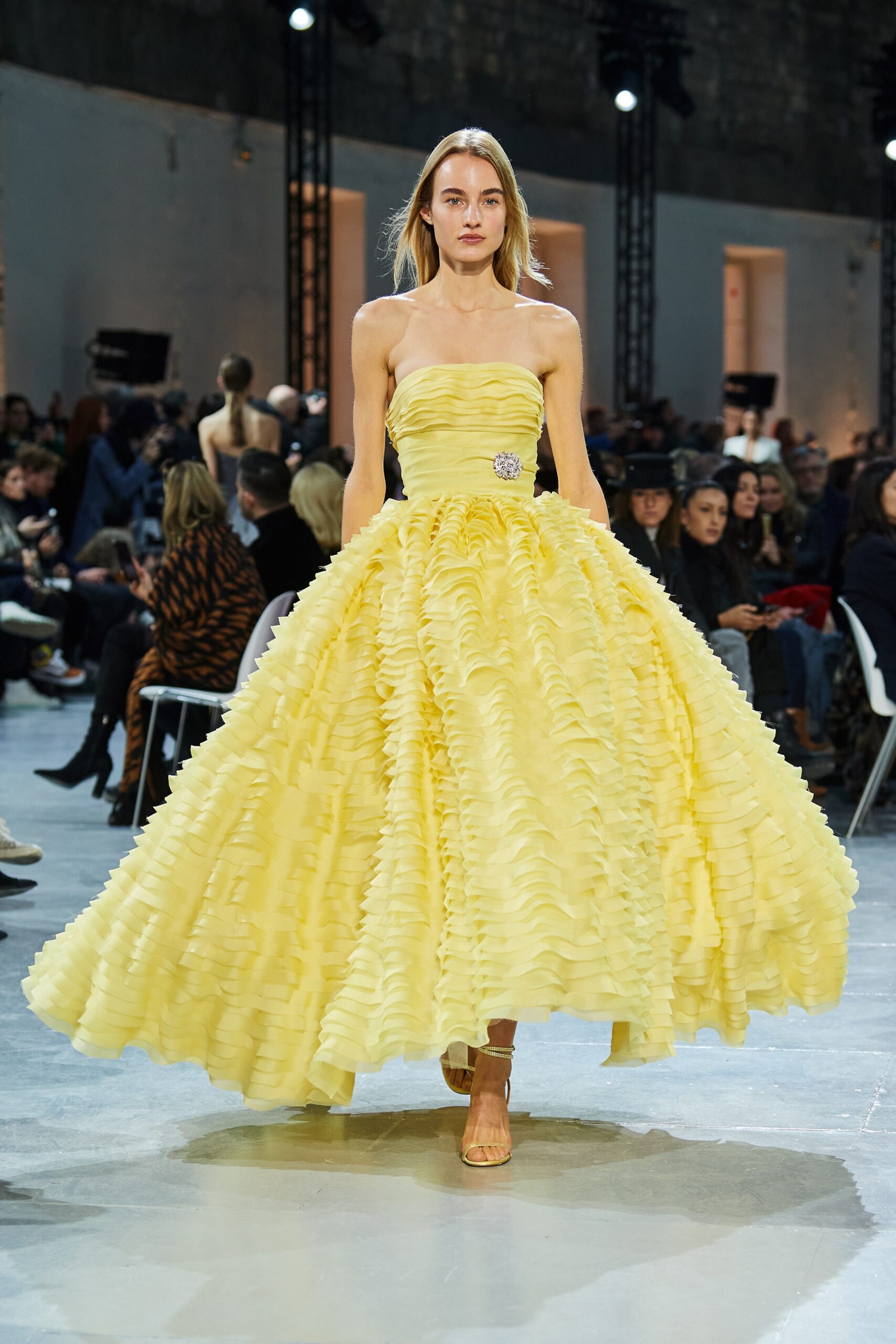yellow ruffled strapless gown