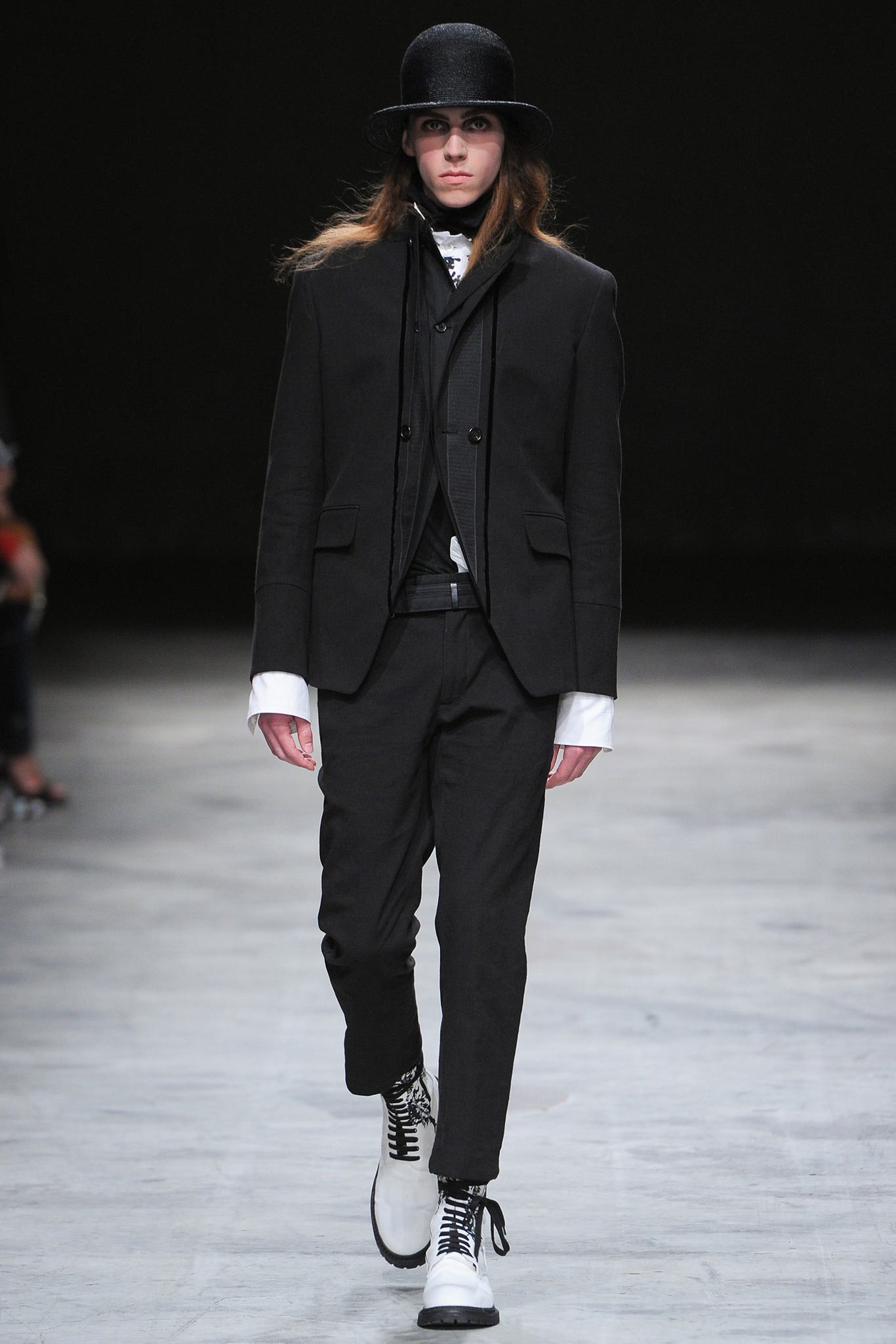 black tailored suit with white shoes