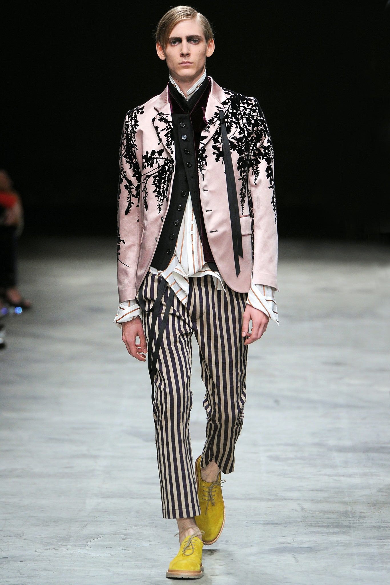 pink embroidered blazer with striped pants