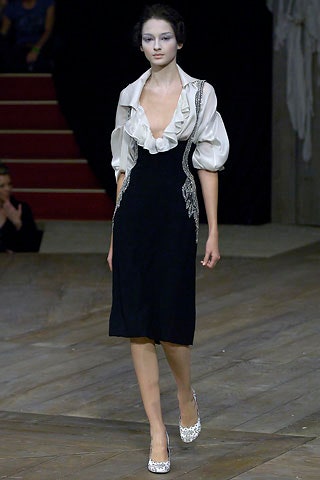 black fitted dress with ruffled blouse
