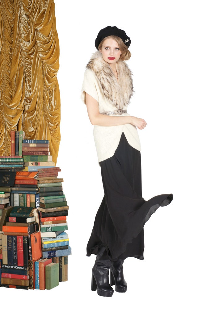 white wool sleeveless top with black gown