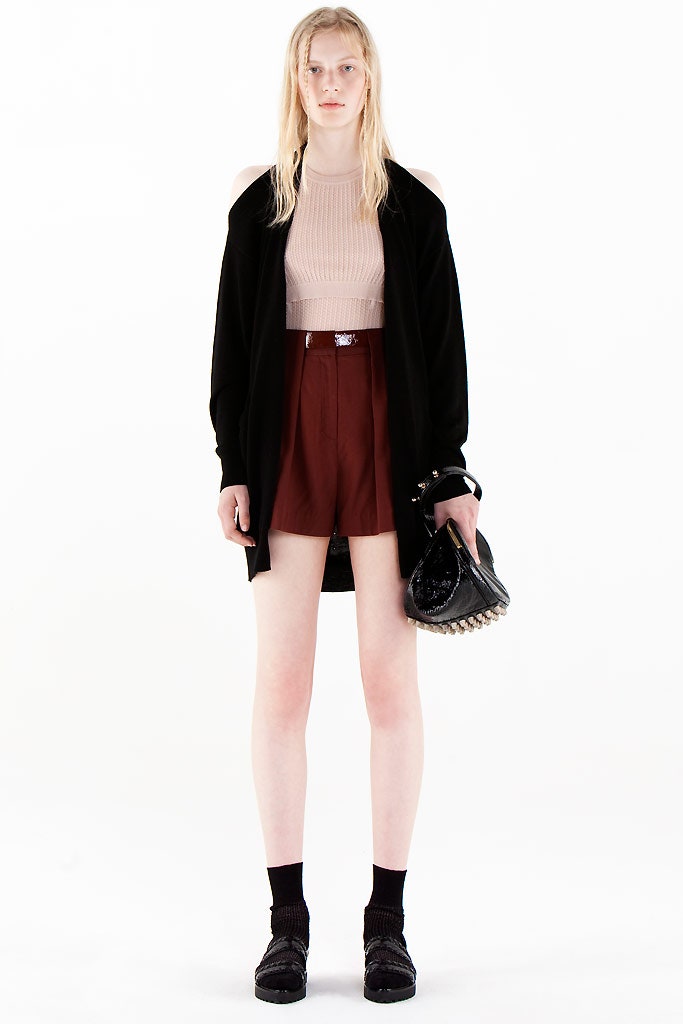 beige fitted top with black coat