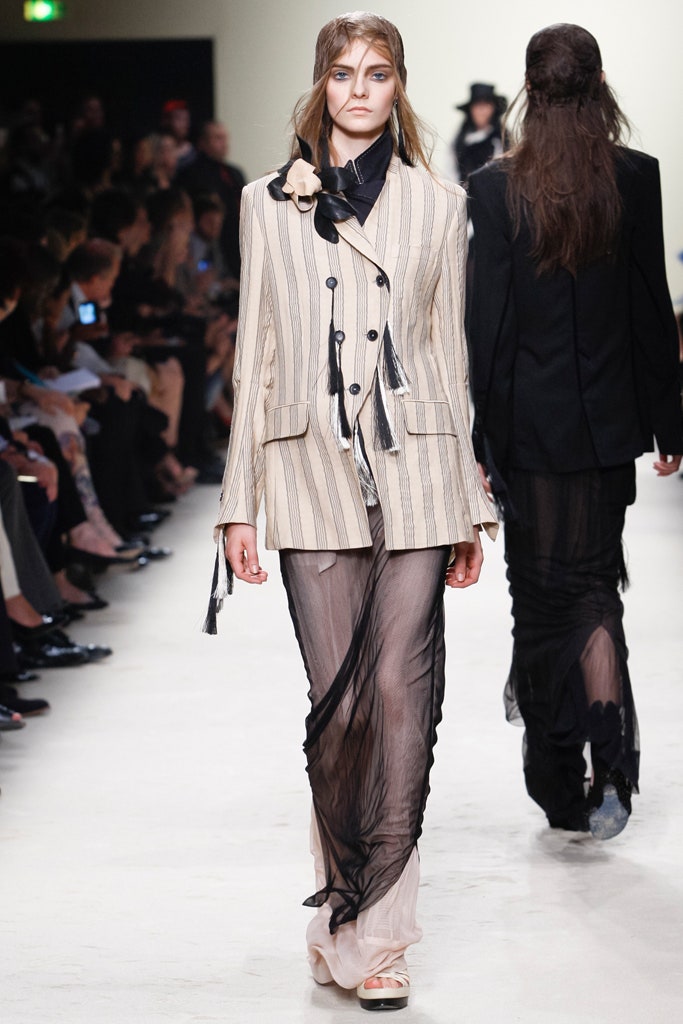 beige striped tailored blazer and black sheer skirt