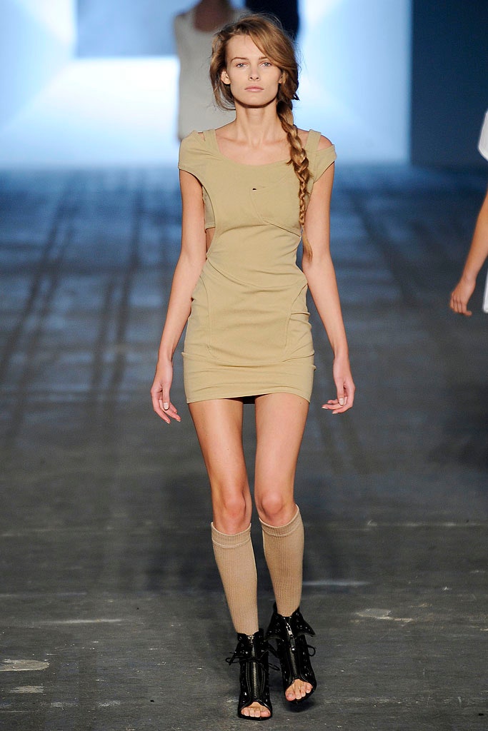 beige fitted mini dress with black shoes