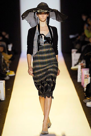 black and green tiered dress with hat