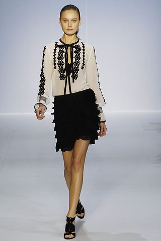 white silk blouse with black ruffled skirt