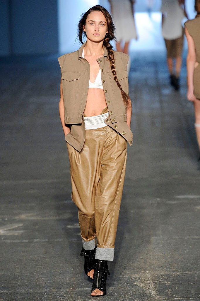 beige cotton vest with brown leather pants
