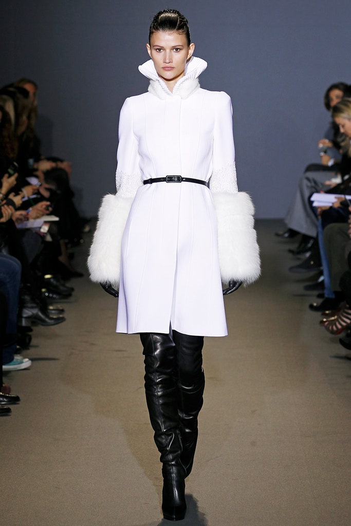 white fitted coat with black boots
