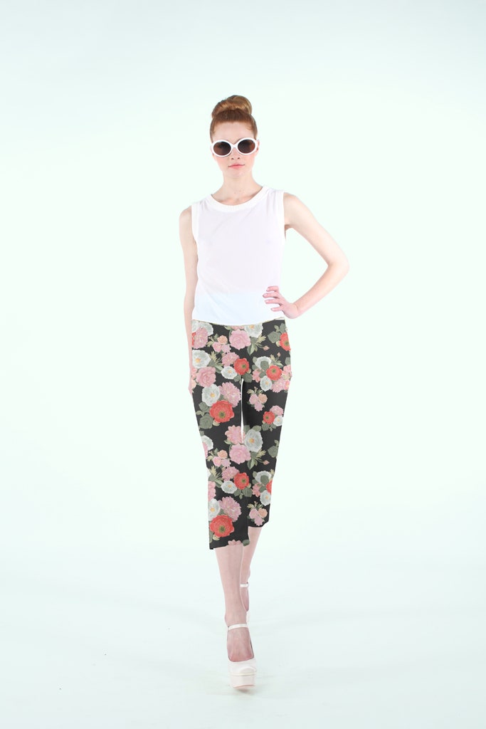 white fitted sleeveless top and black floral pants