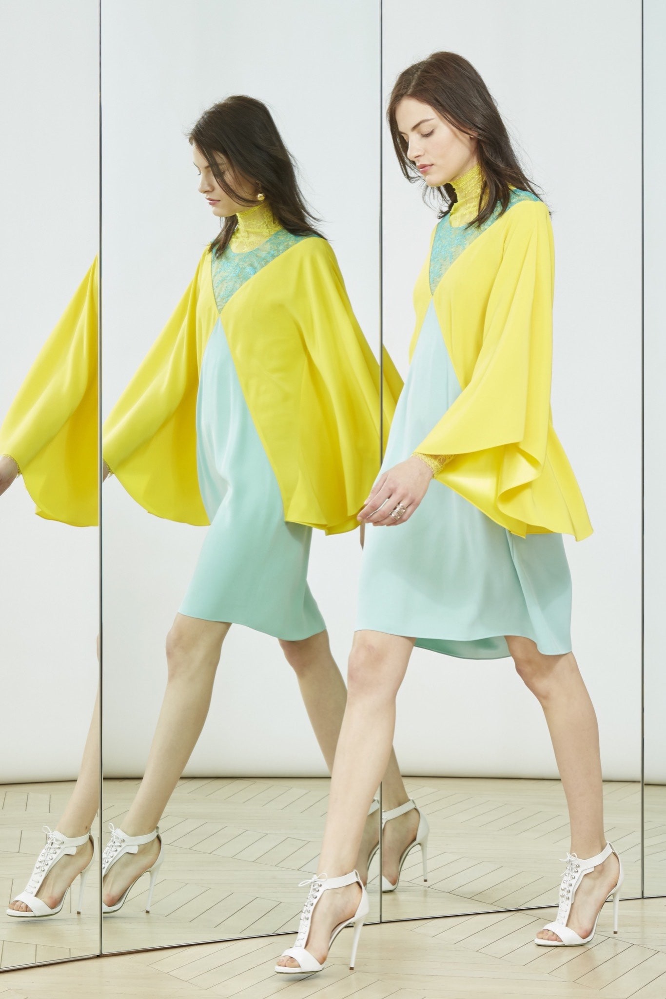 yellow cape over blue dress