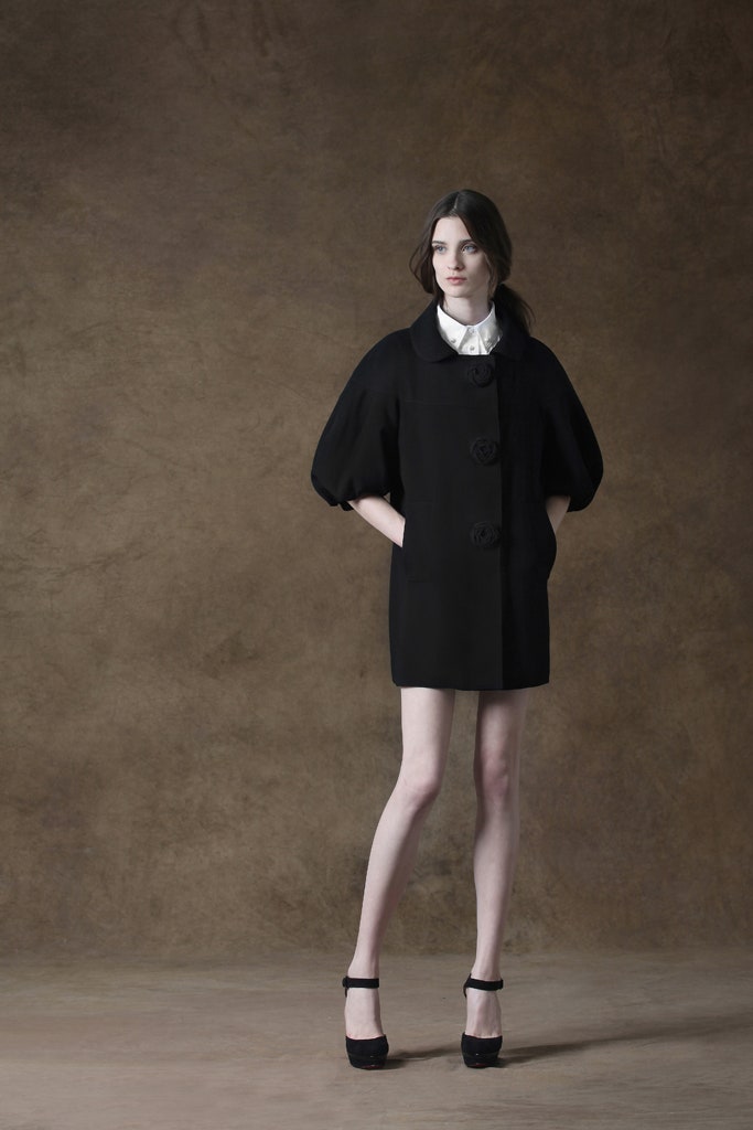 black wool coat with white blouse