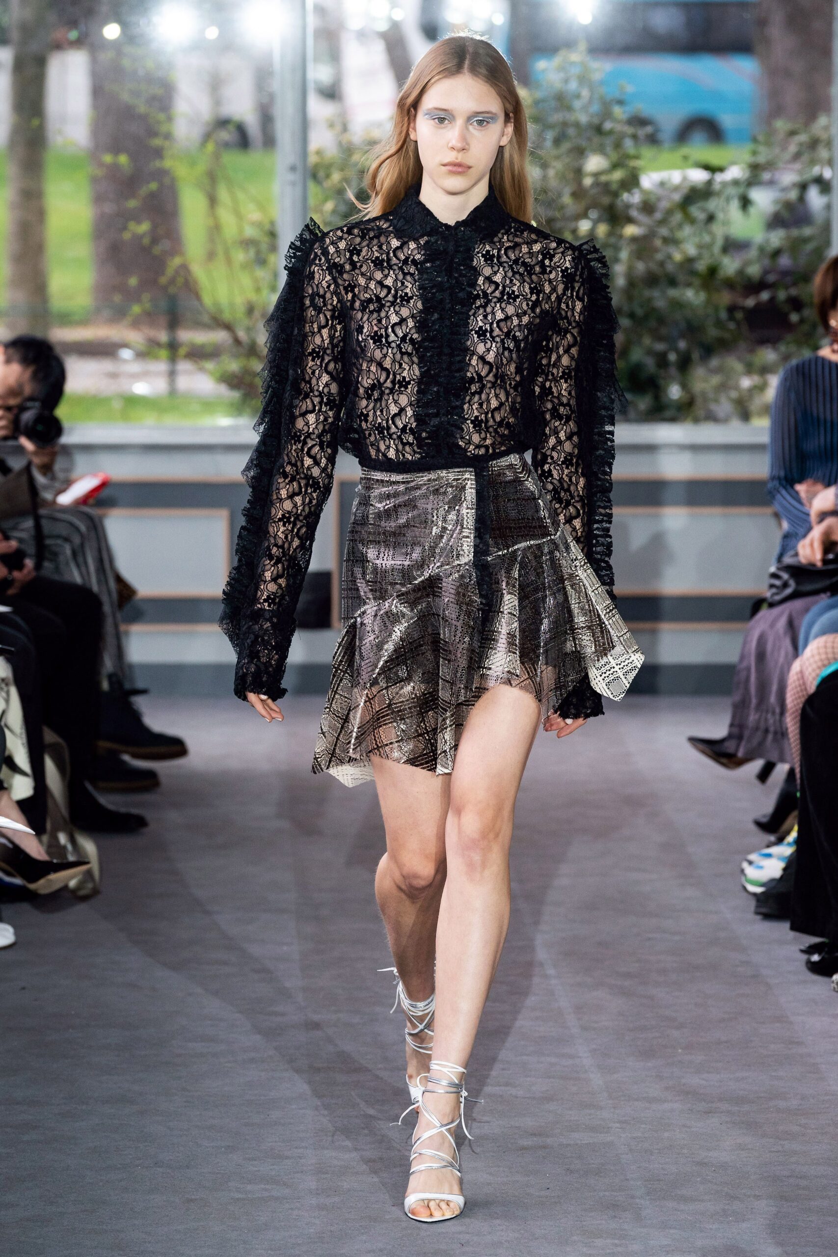 black lace blouse with metallic skirt