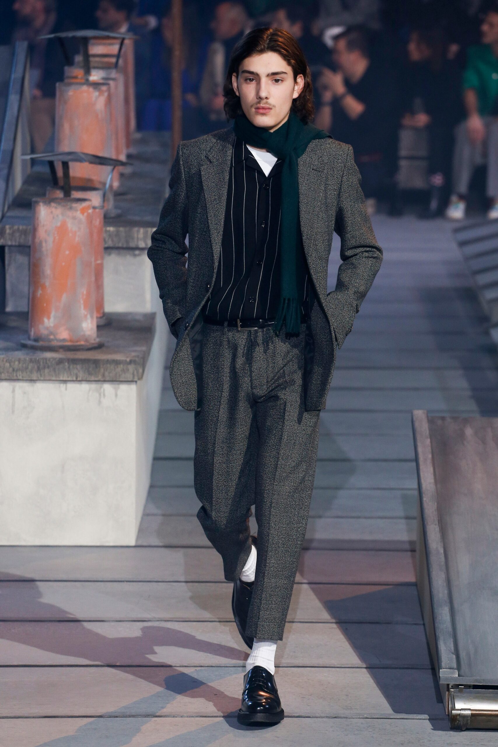 gray tailored suit with green scarf
