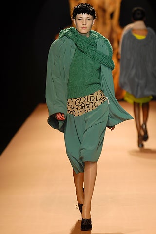green relaxed top with gray oversized coat