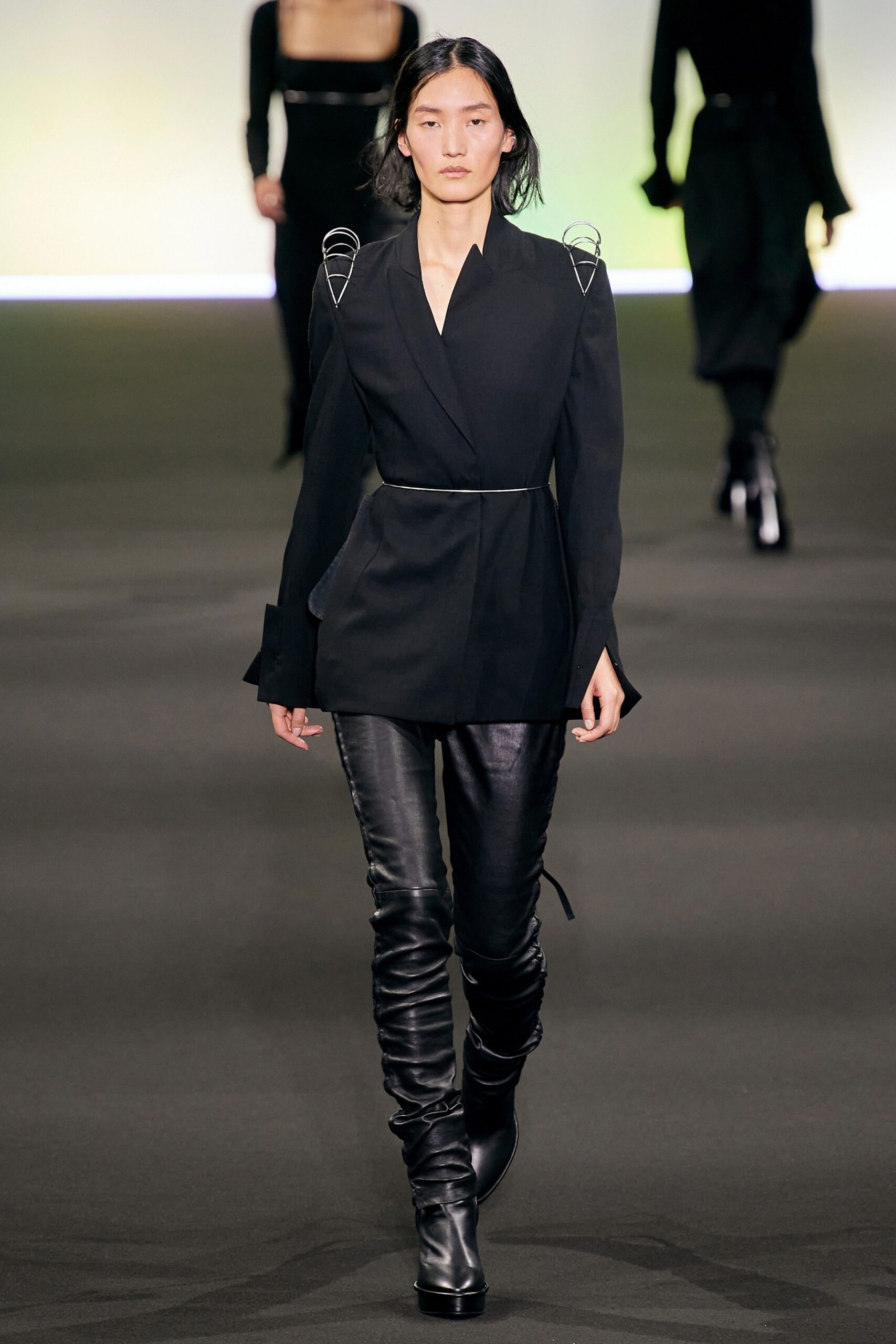 black fitted blazer and leather pants