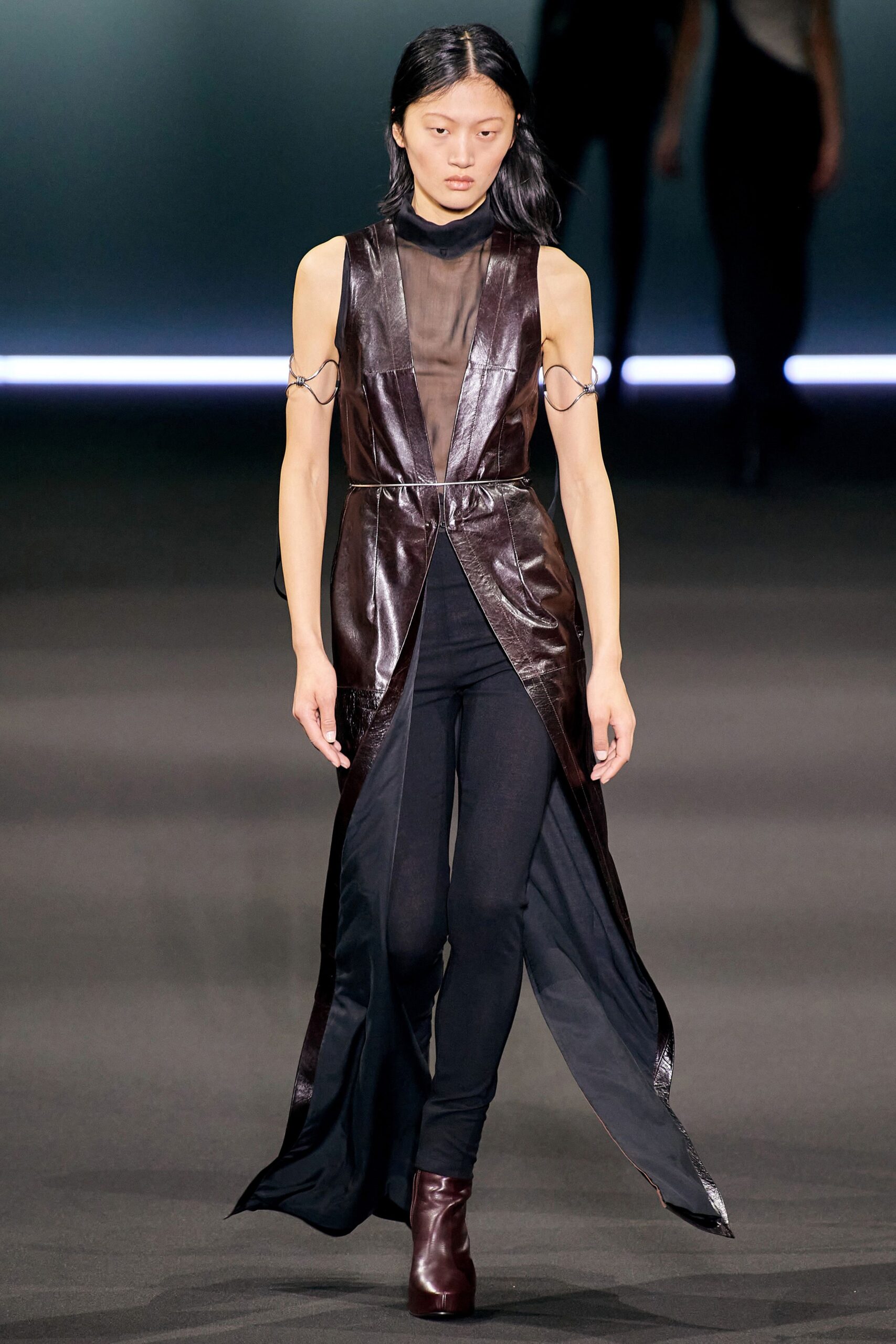 brown leather sleeveless dress with black pants