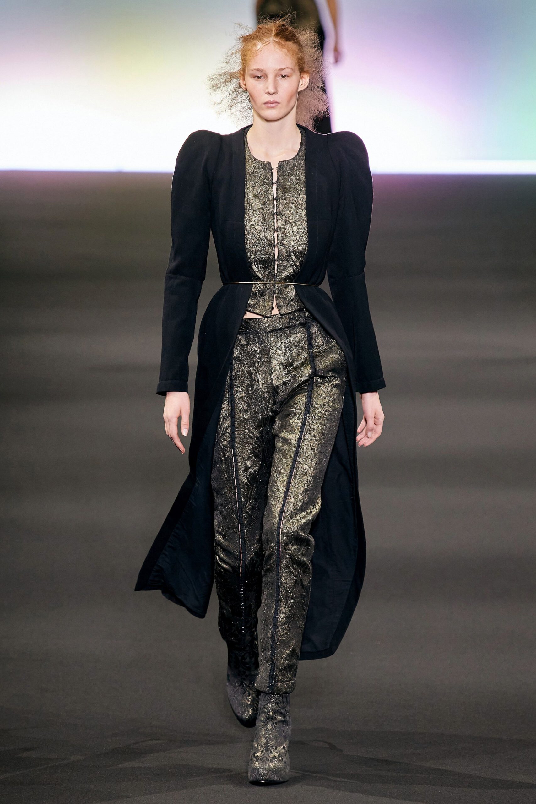 black silk fitted coat and gold pants