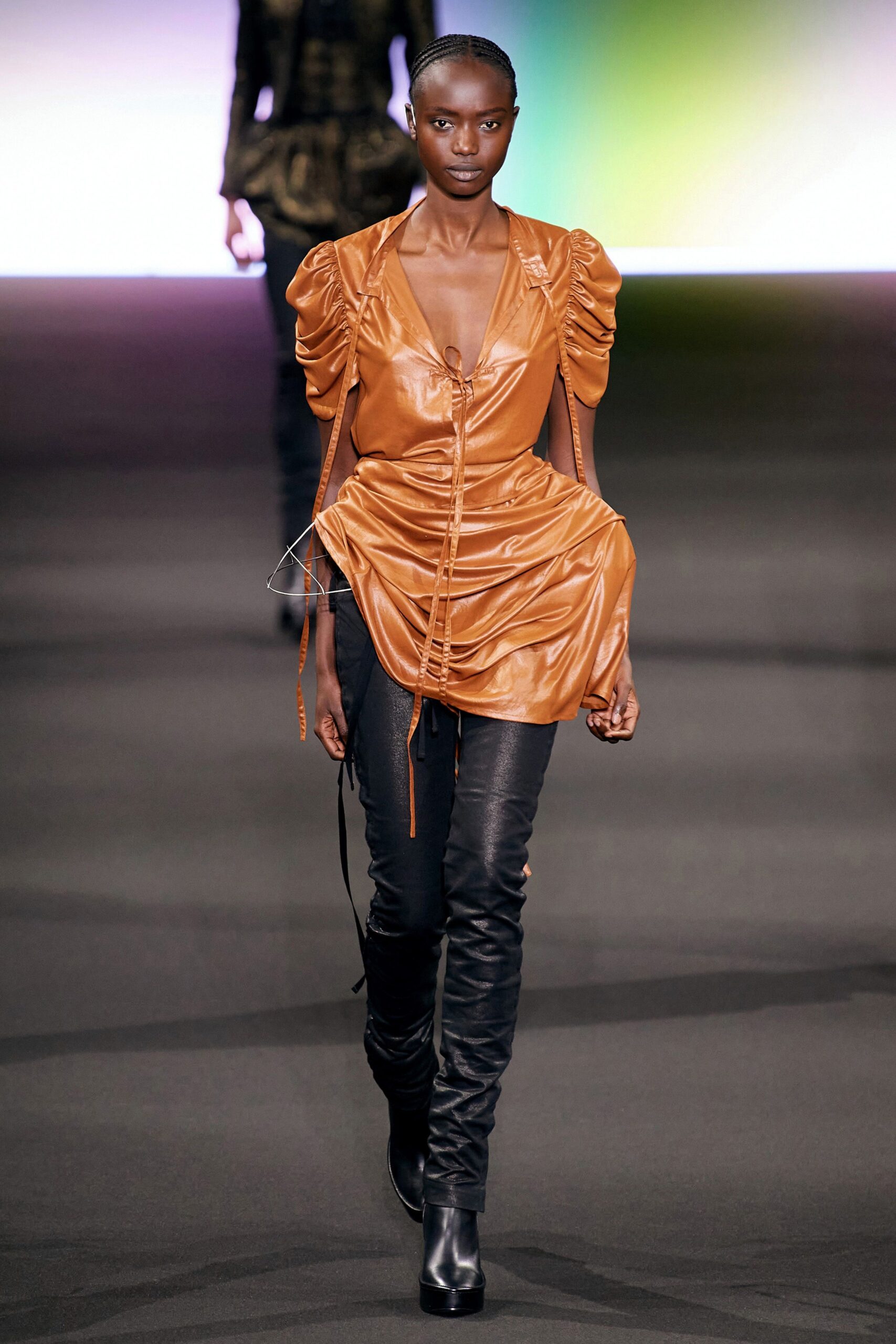 fitted orange silk top with black leather pants