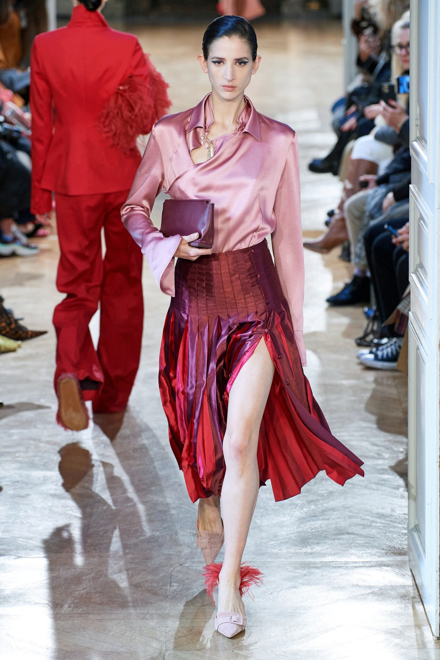 red silk slit fitted high-waisted pleated flowing skirt
