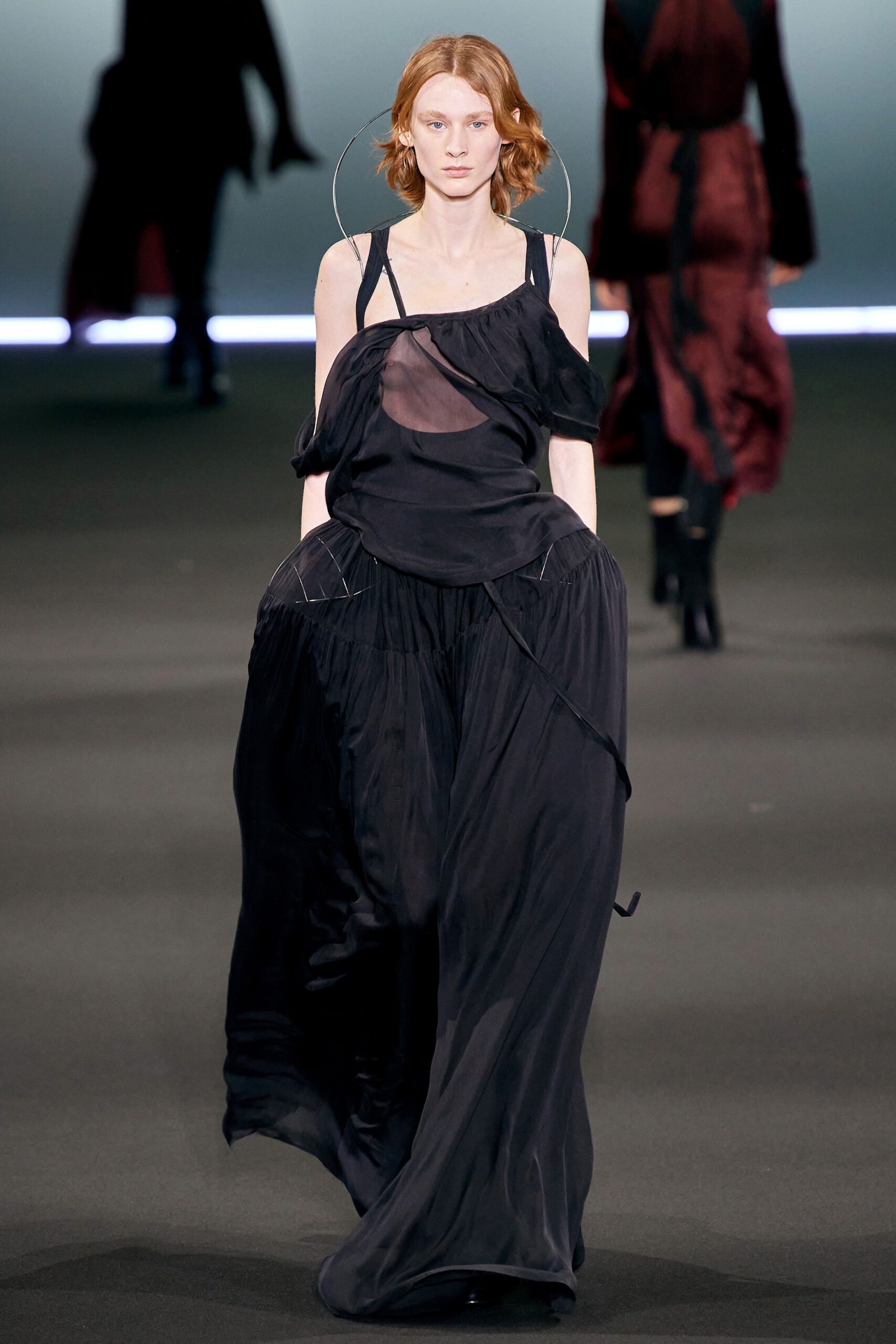 black flowing sleeveless dress