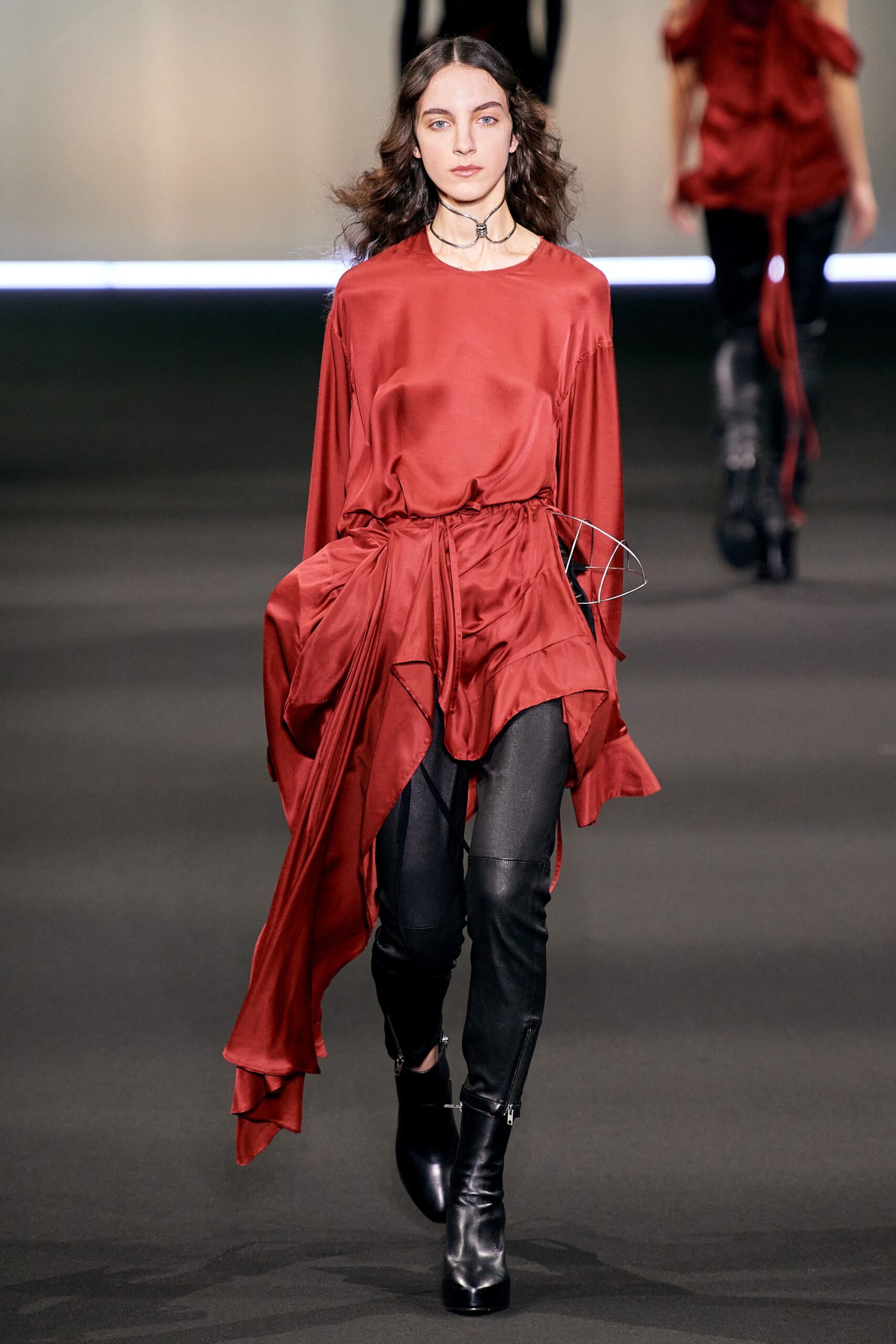red silk relaxed top with black leather pants
