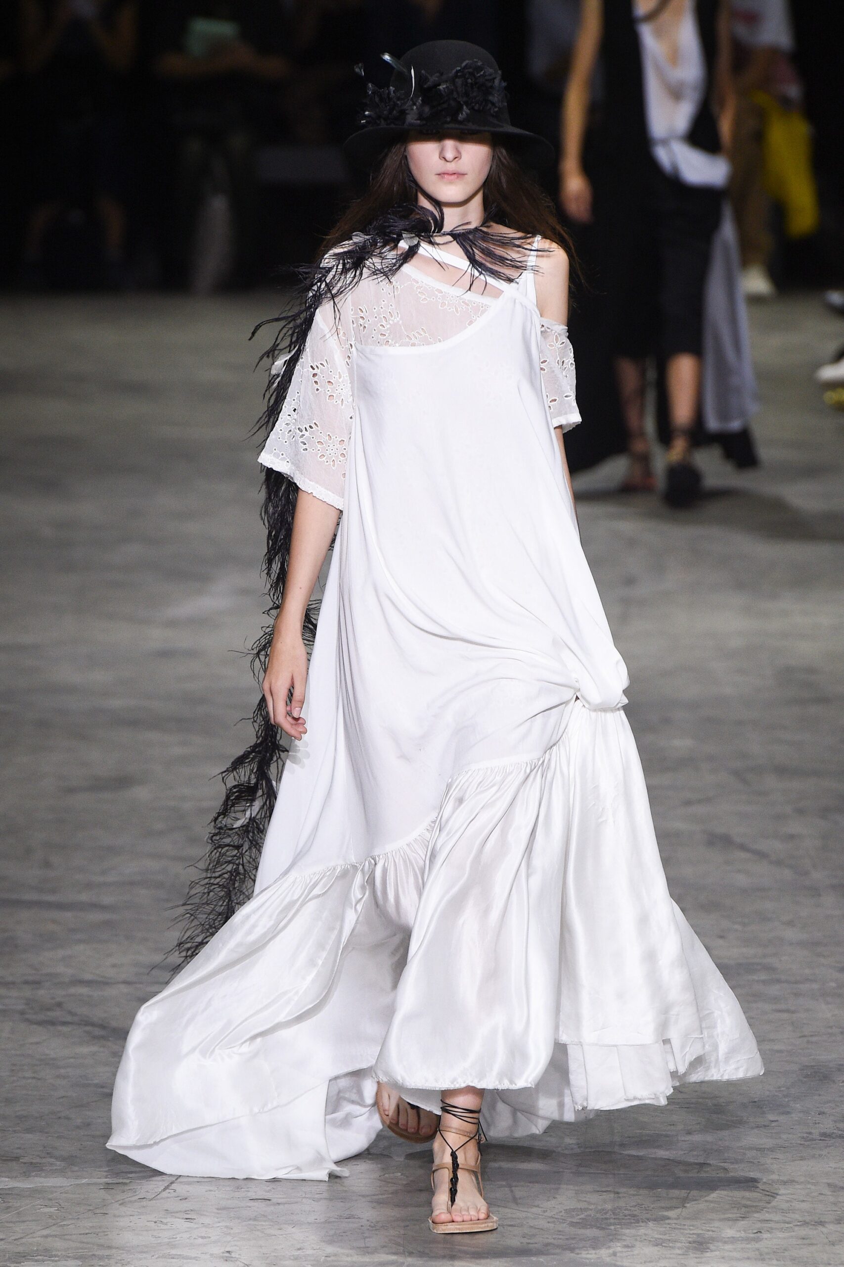 white flowing maxi dress with black hat