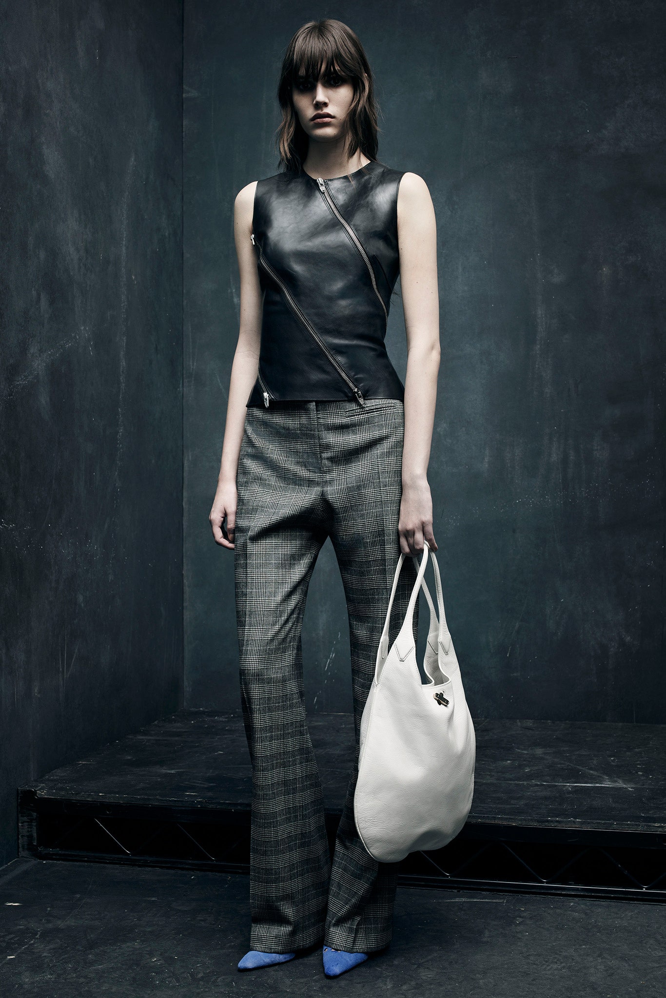 black leather sleeveless top with flared pants