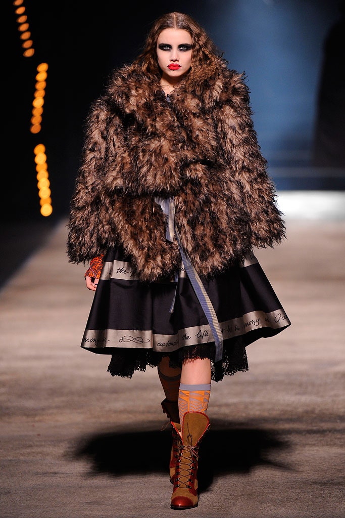 brown faux-fur coat and black dress
