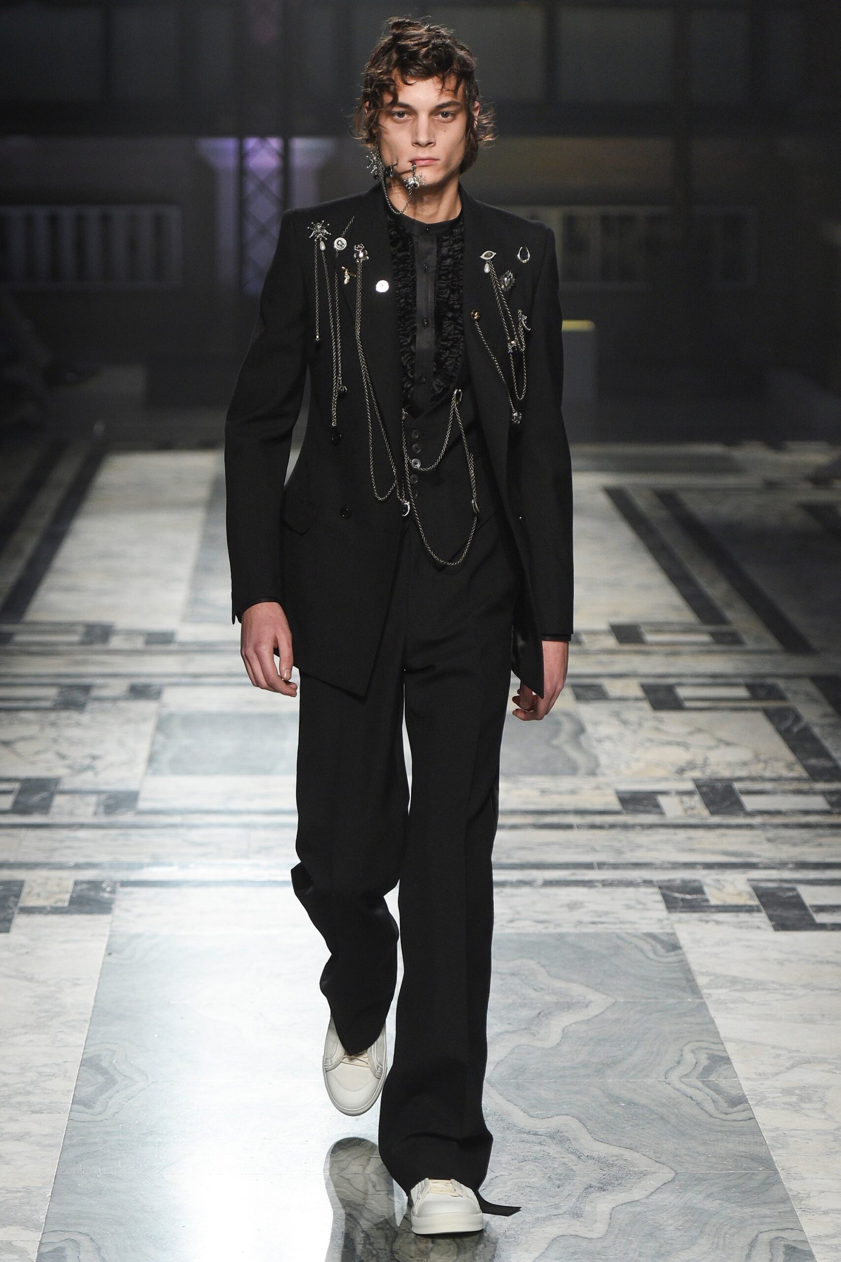 black tailored suit with white shoes