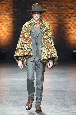 multi-colored wool cape with gray suit