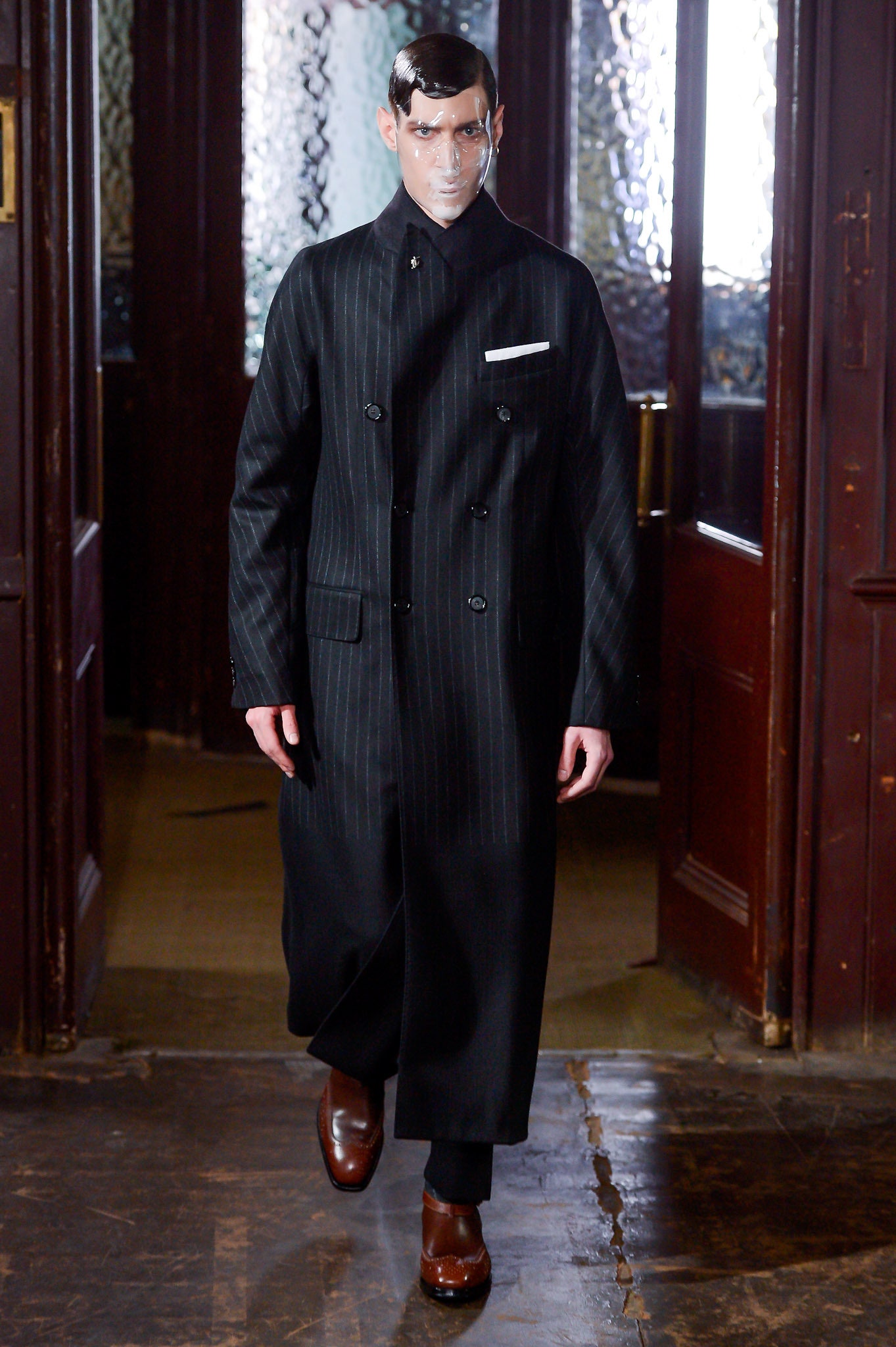 black tailored coat with slim pants