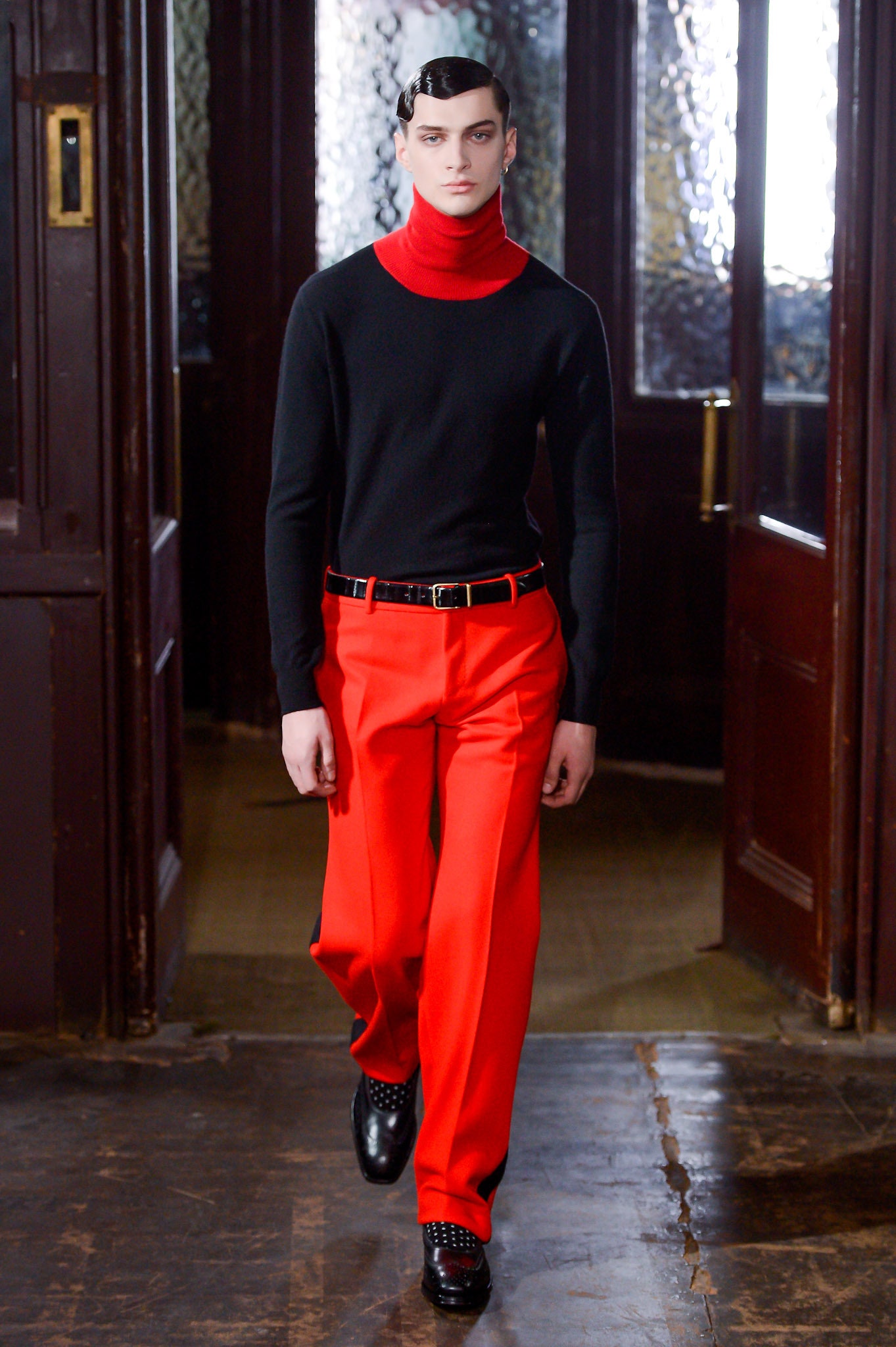black fitted turtleneck and red wide-leg pants