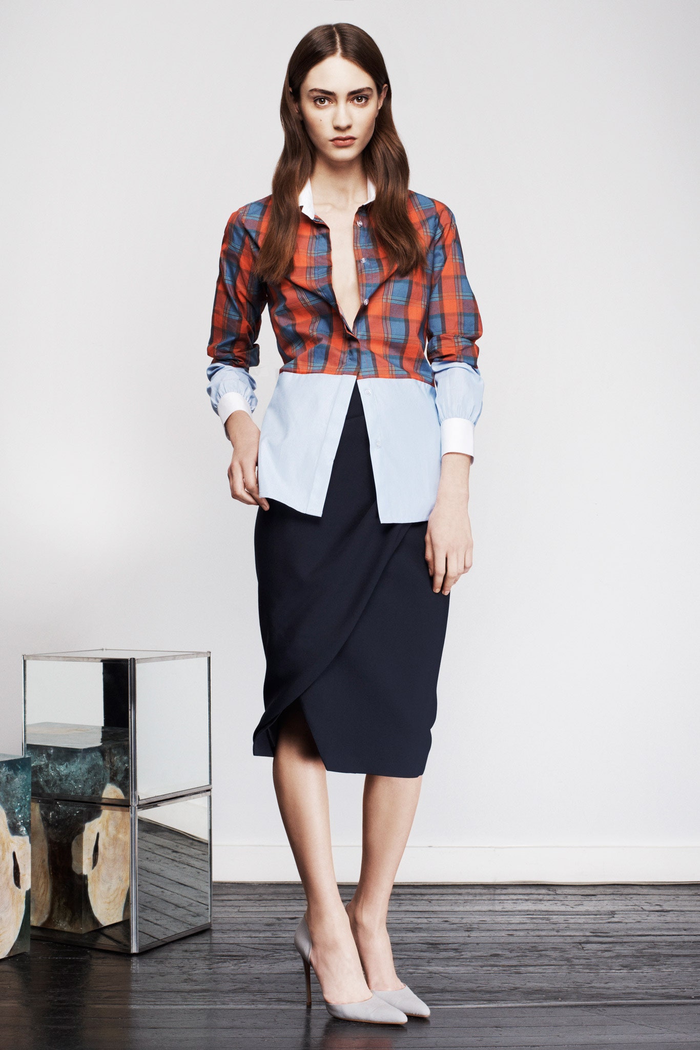 fitted checked shirt and black midi skirt
