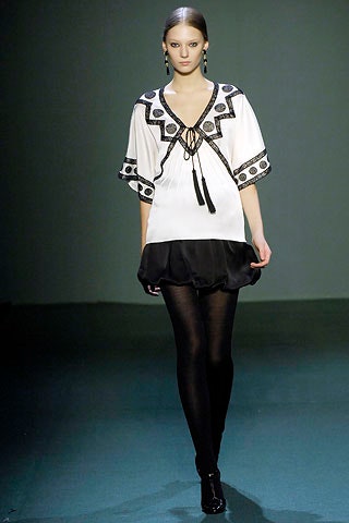 fitted white top with black skirt