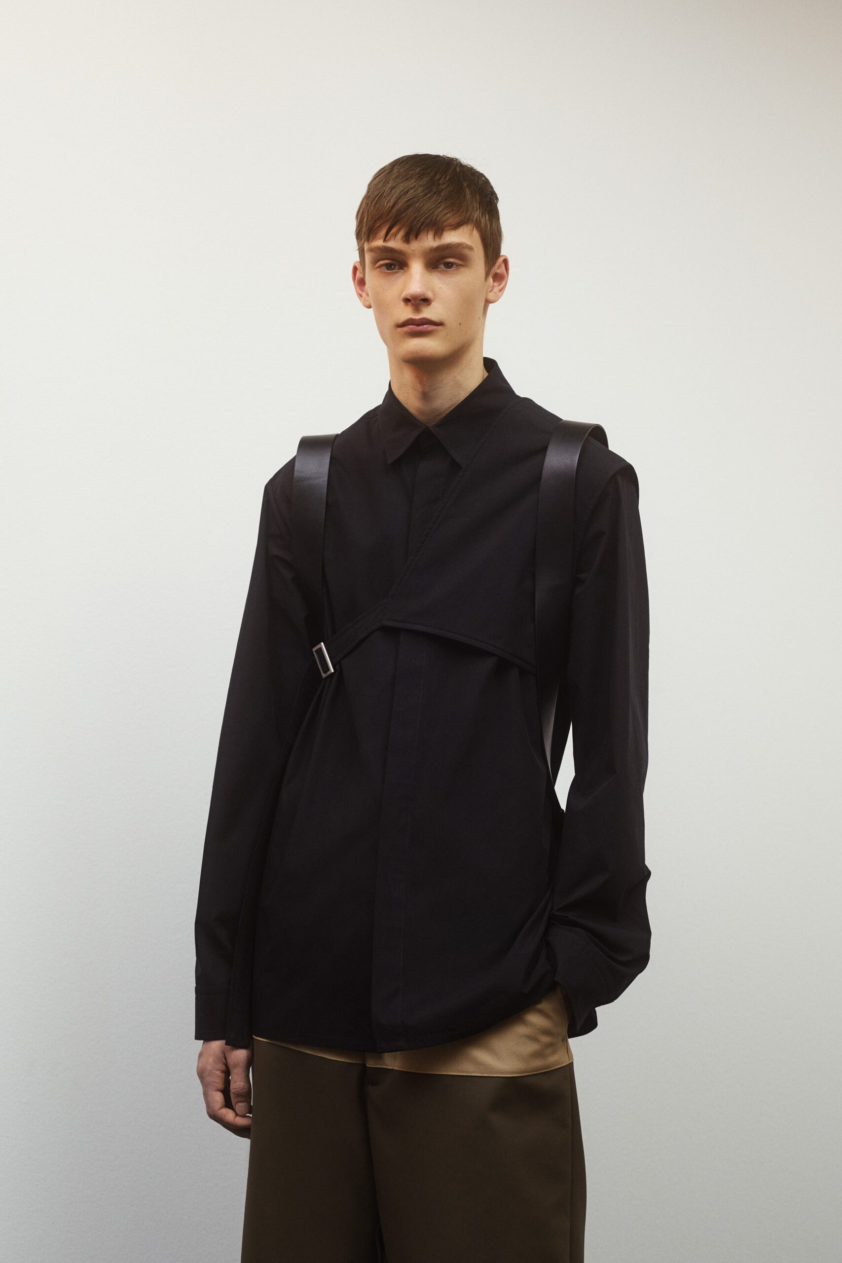 black relaxed shirt with beige pants