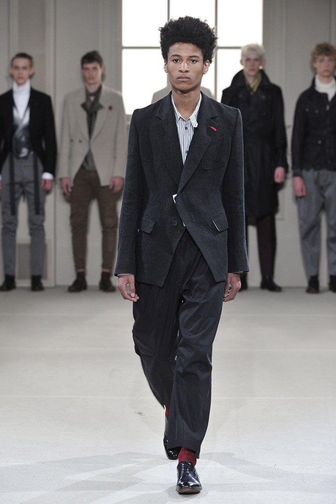 black tailored blazer with pleated pants